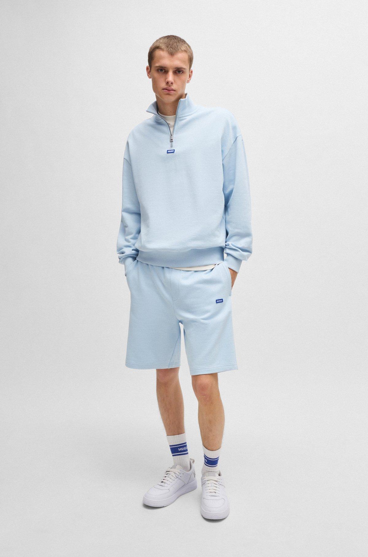Cotton-terry shorts with blue logo patch Product Image