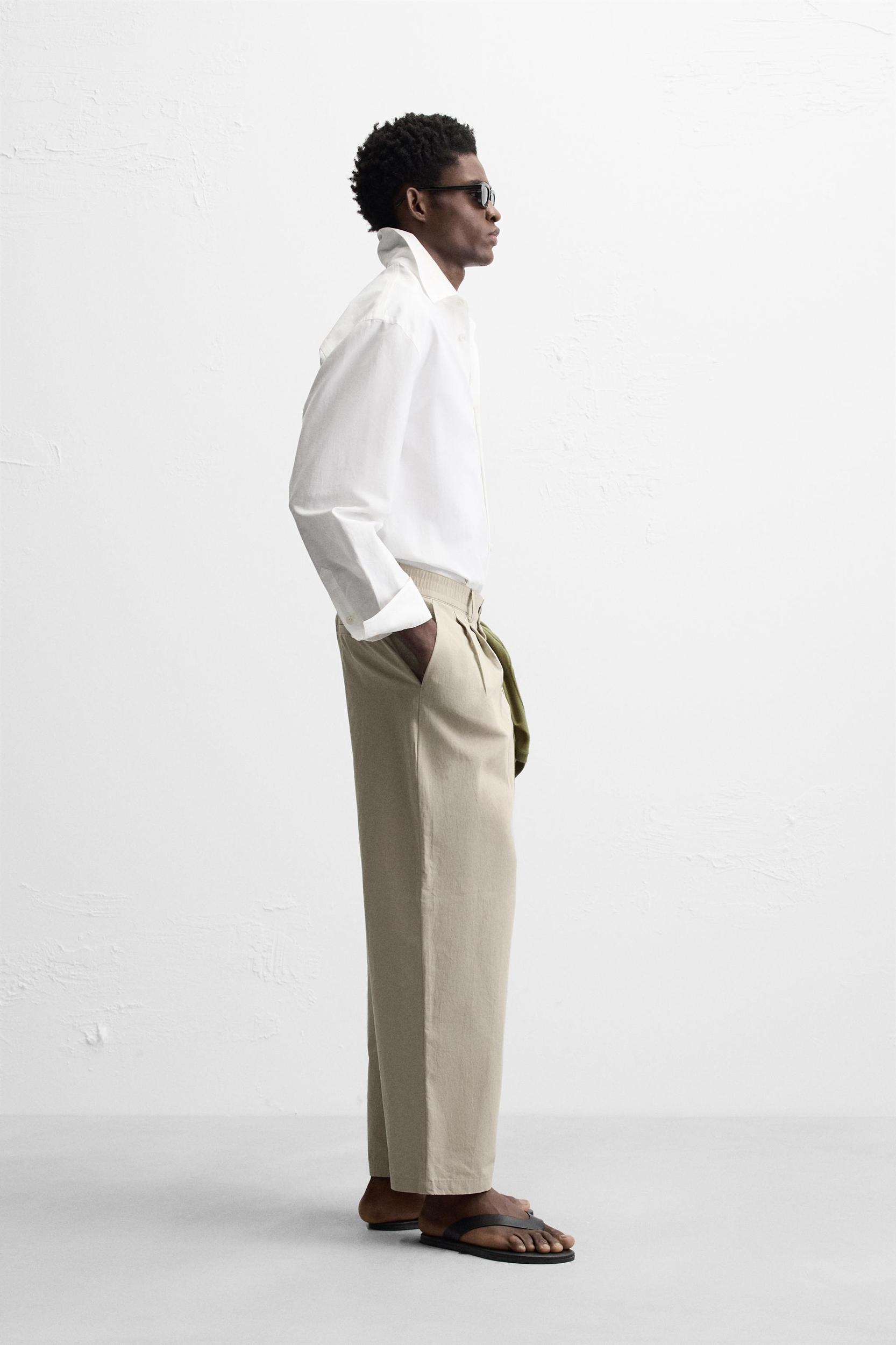 PLEATED CHINO PANTS Product Image