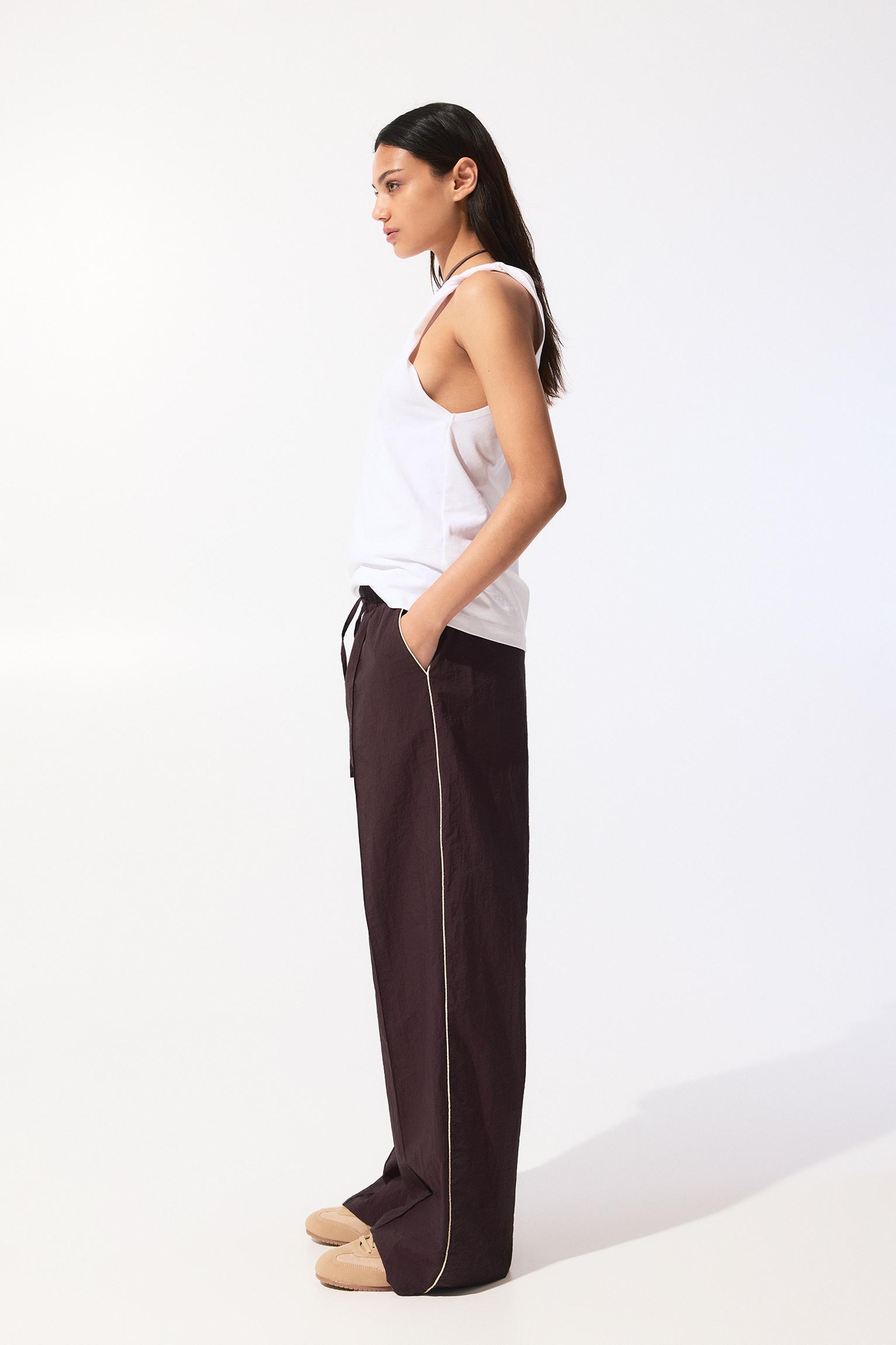 Tracksuit pants with side stripes Product Image