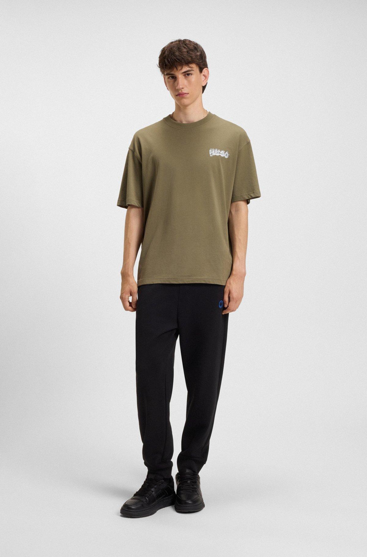 Cotton-terry tracksuit bottoms with Happy HUGO Product Image