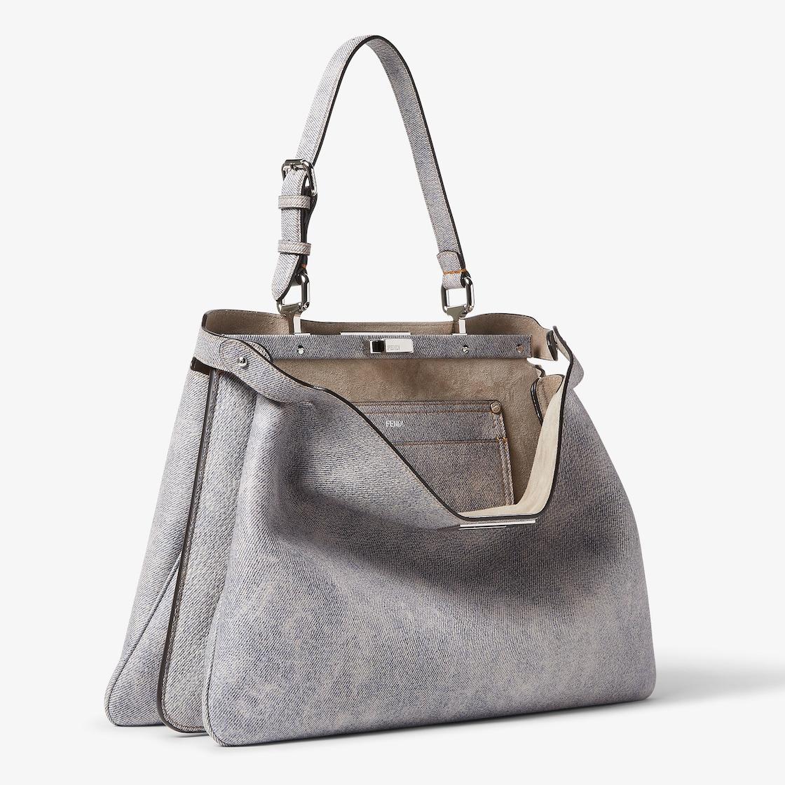 Peekaboo Soft LargeGray leather bag with a faded denim effect. Product Image