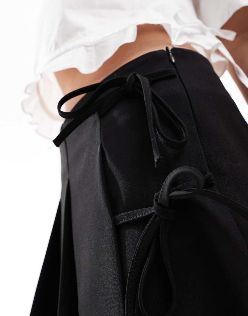 Bershka bow front pleated tailored mini skirt in black Product Image