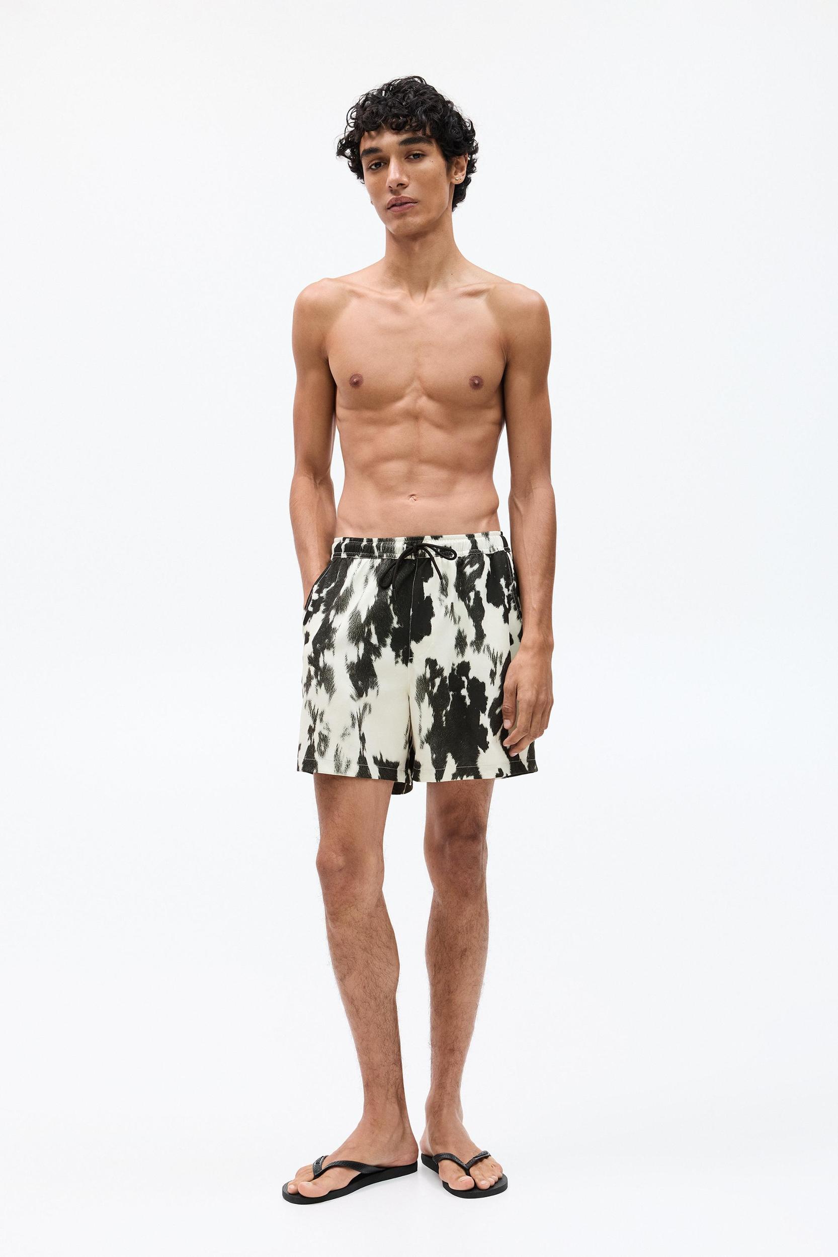 Cow animal print board shorts Product Image