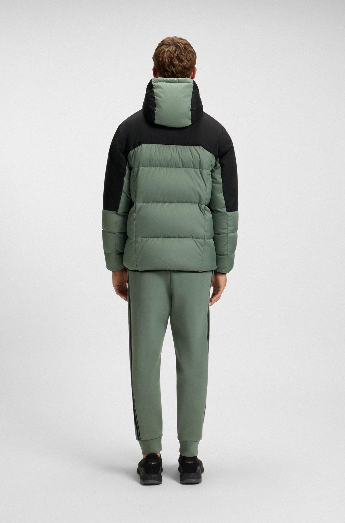 Water-repellent down jacket with detachable hood and sleeves Product Image