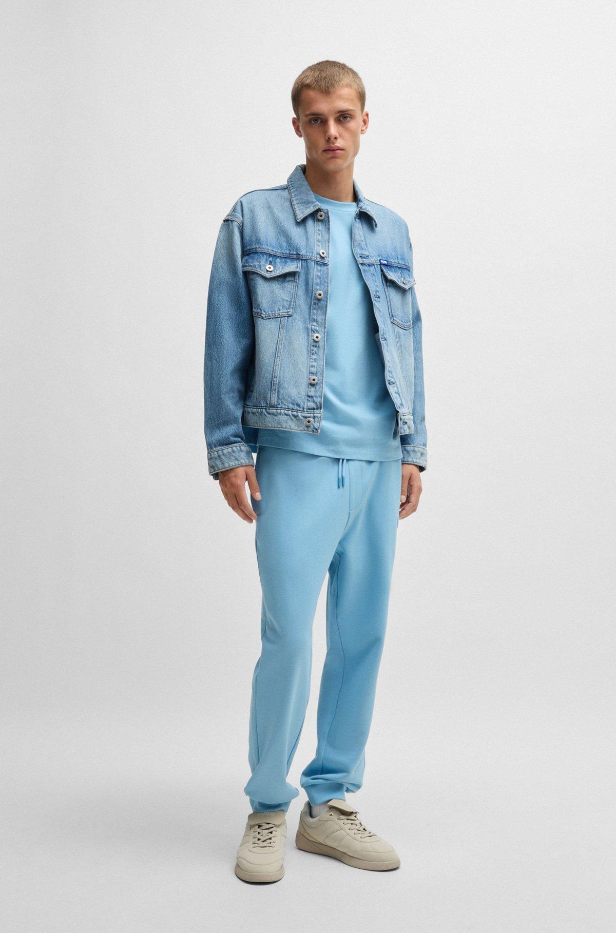 Cotton-terry tracksuit bottoms with Happy HUGO logo Product Image