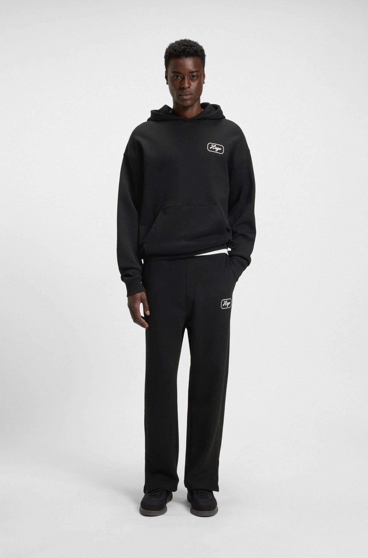 Cotton-terry tracksuit bottoms with embroidered graphics Product Image
