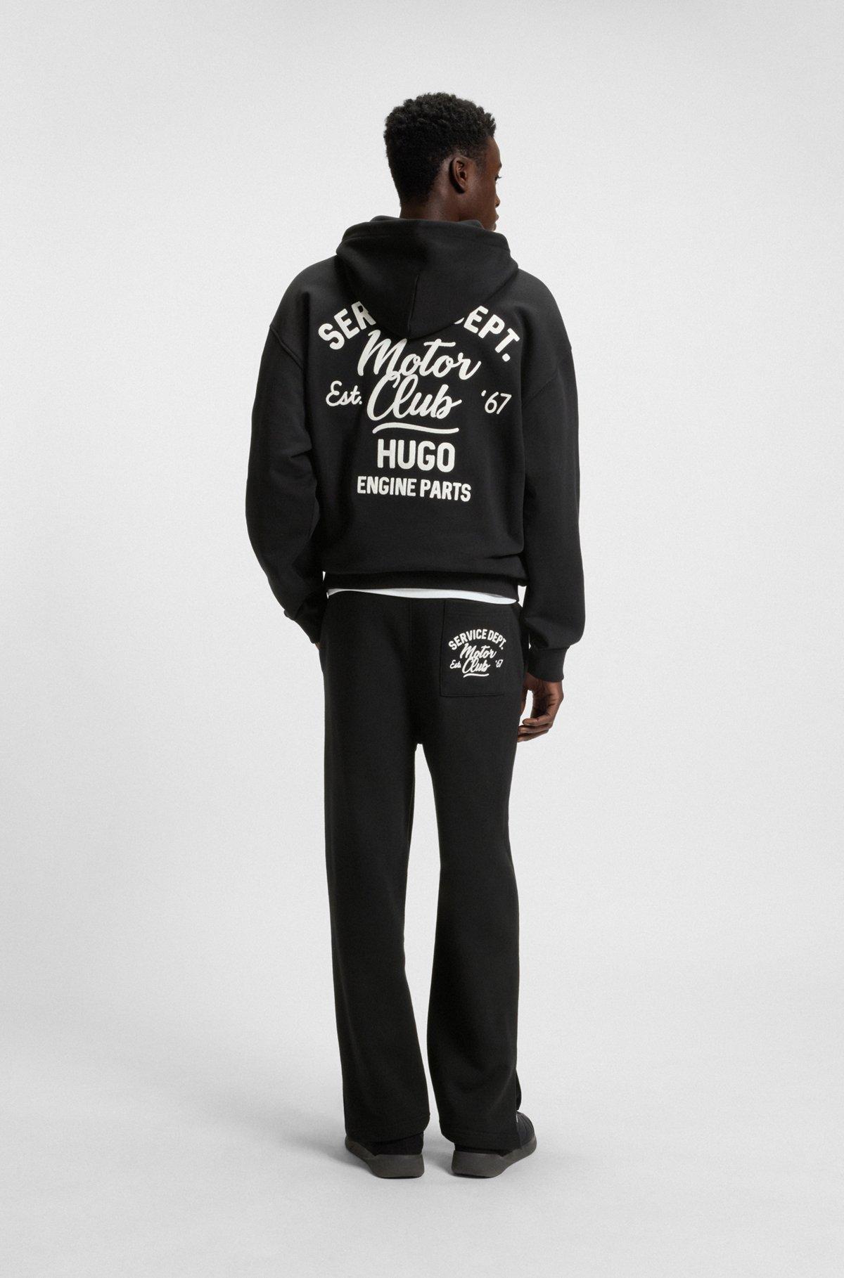 Cotton-terry tracksuit bottoms with embroidered graphics Product Image