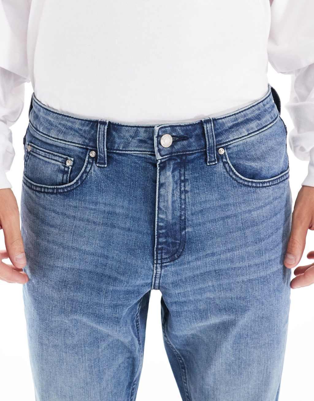 ASOS DESIGN slim jeans with tint in mid wash blue Product Image