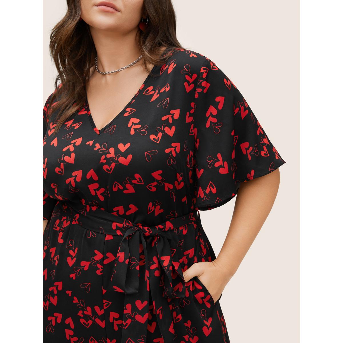 Plus Size Black Heart Print Pocket Belted Jumpsuit Women Elegant Short sleeve V-neck Everyday Loose Jumpsuits BloomChic 22-24/3X Product Image