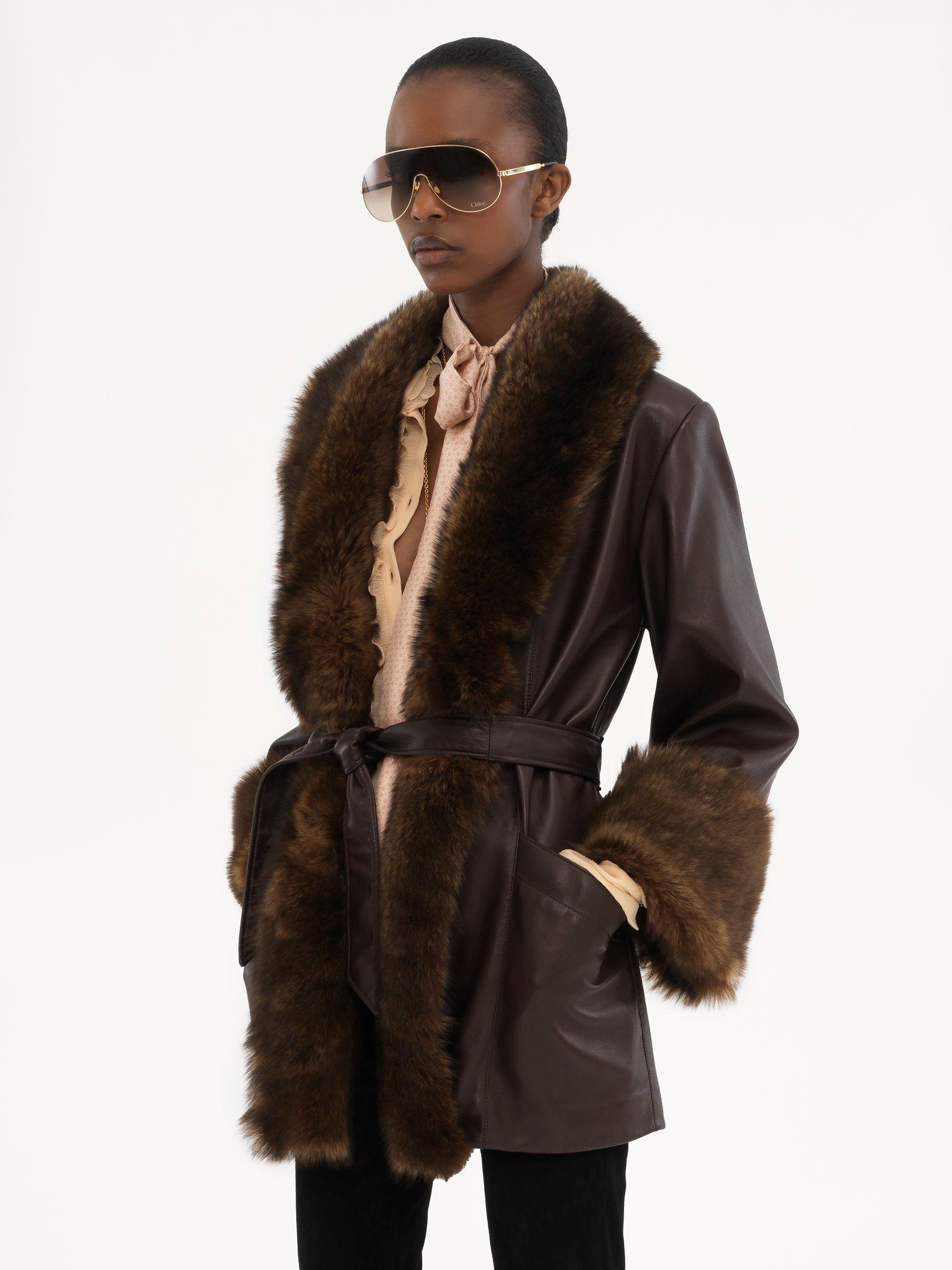 Belted oversized coat in leather Product Image