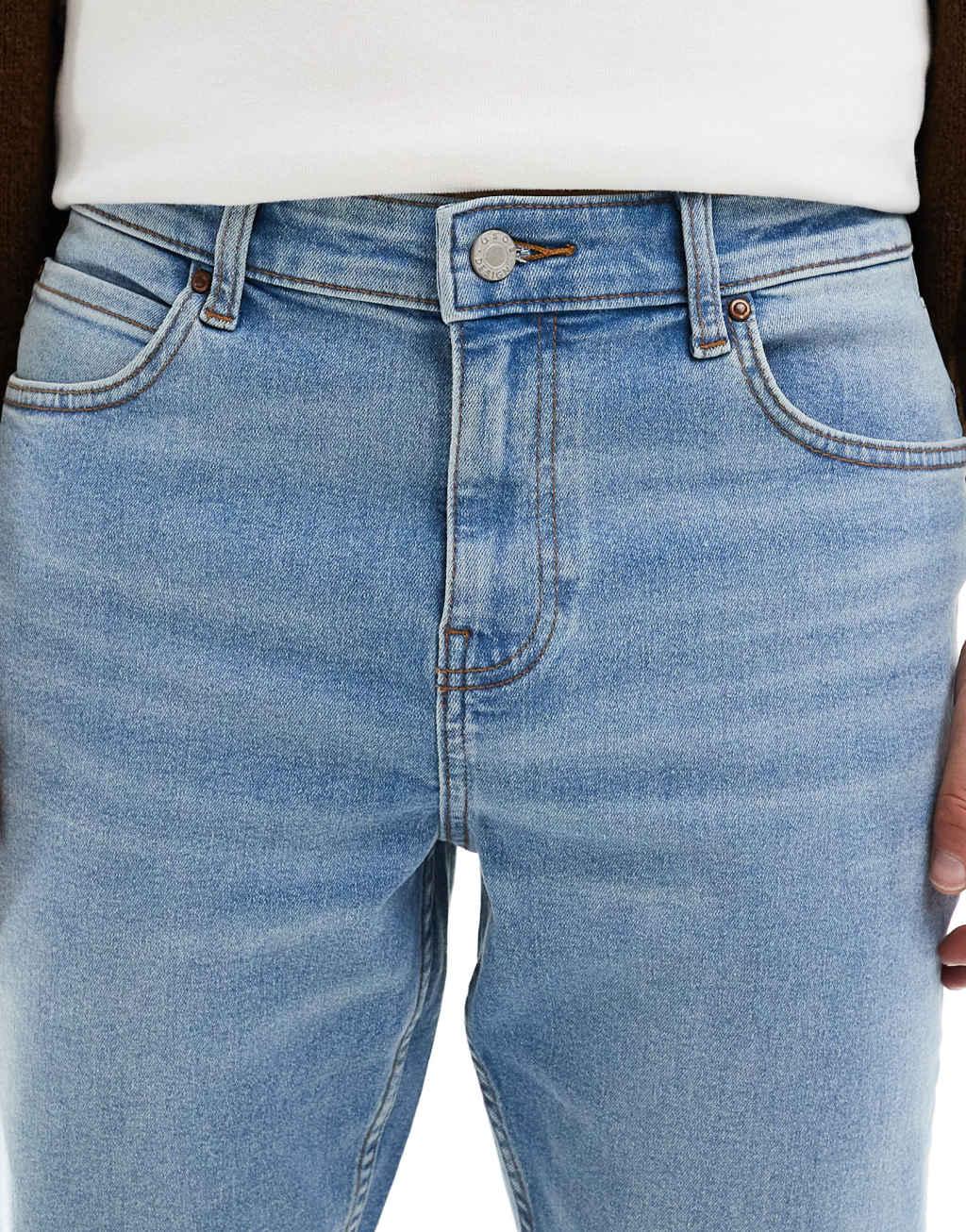 ASOS DESIGN stretch flare jeans in light wash blue Product Image