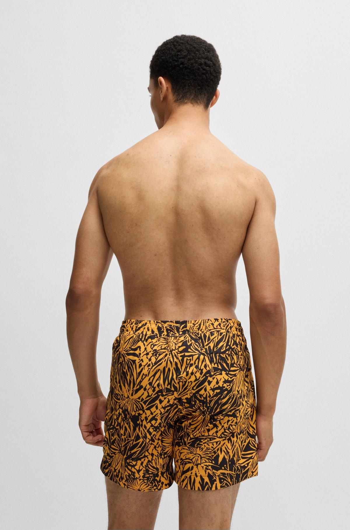 HUGO - Fully lined swim shorts with seasonal print - Black Product Image