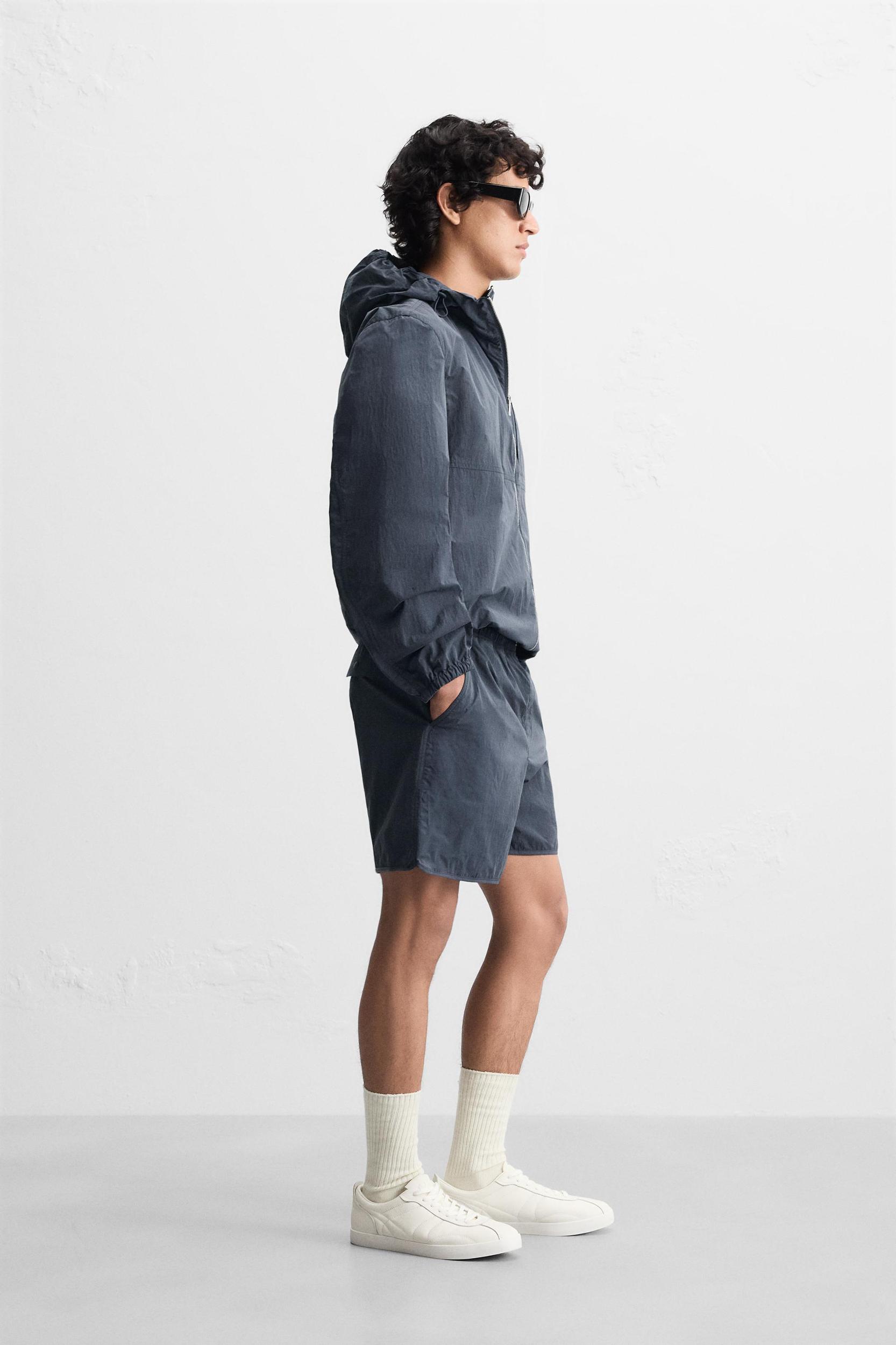 HOODED TECHNICAL JACKET Product Image