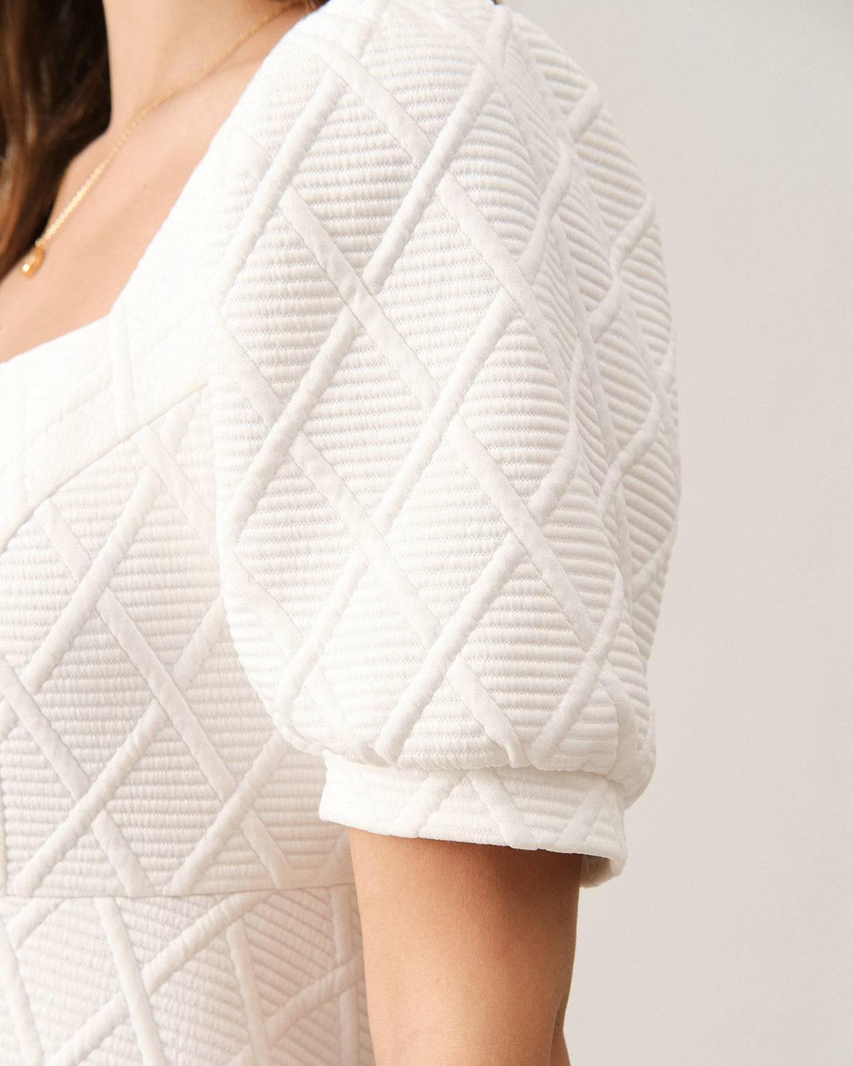 The Solid Textured Puff Sleeve Mini Dress Female Product Image