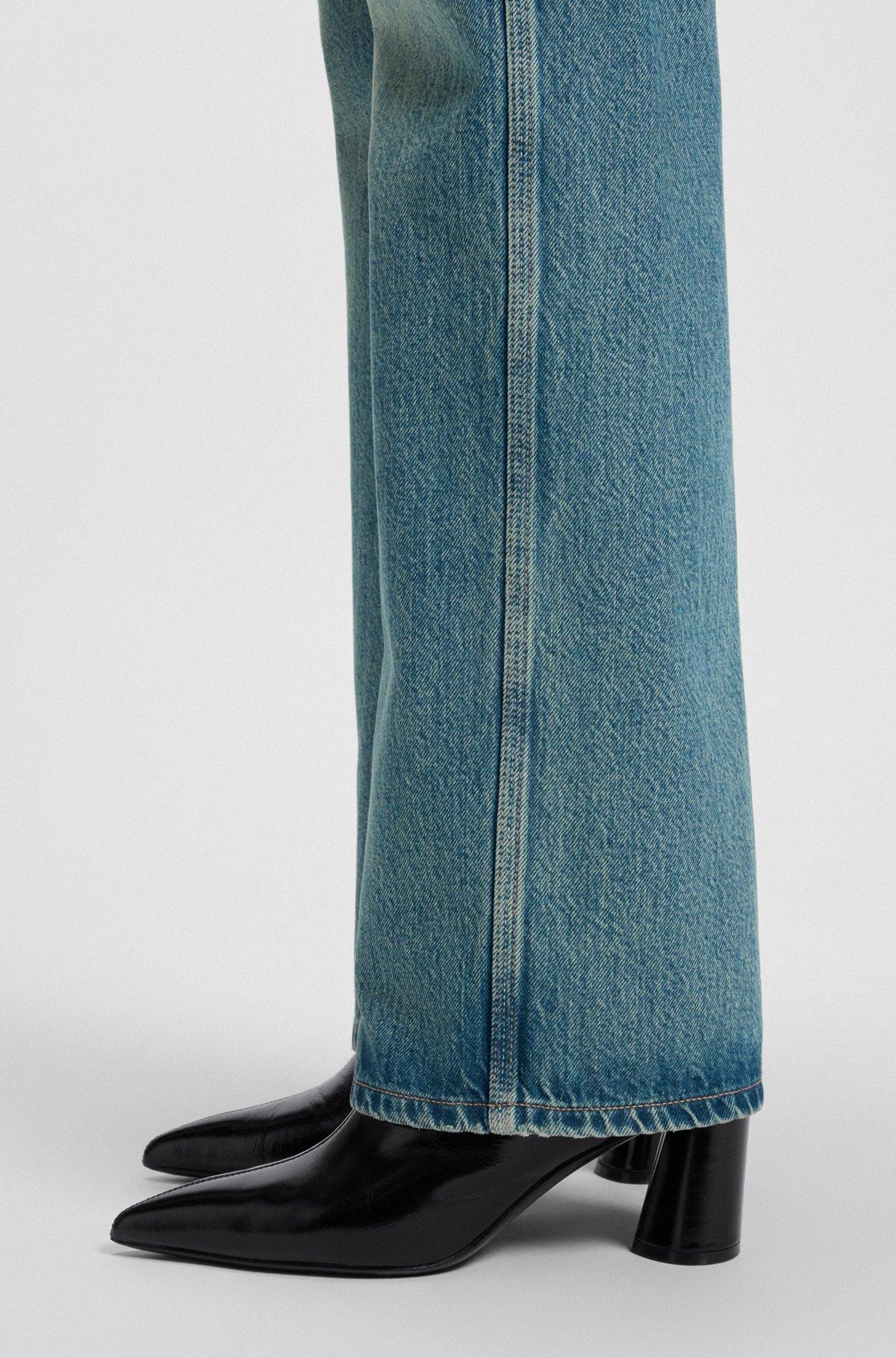 Ankle boots in leather with embossed logo Product Image