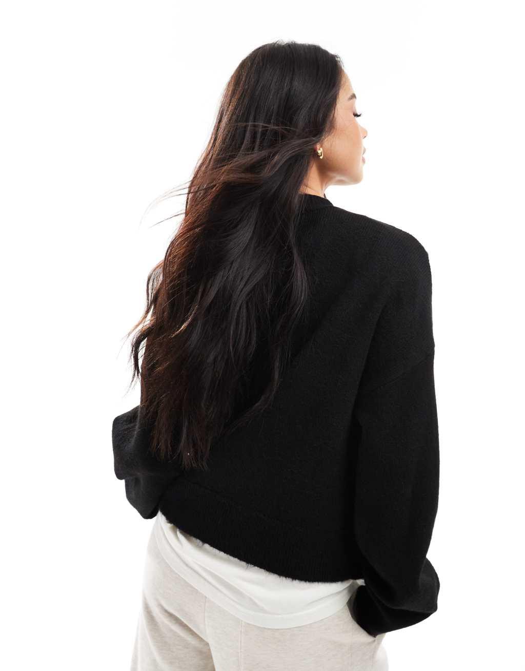 ASOS DESIGN knit sweater with tassel floral in black Product Image