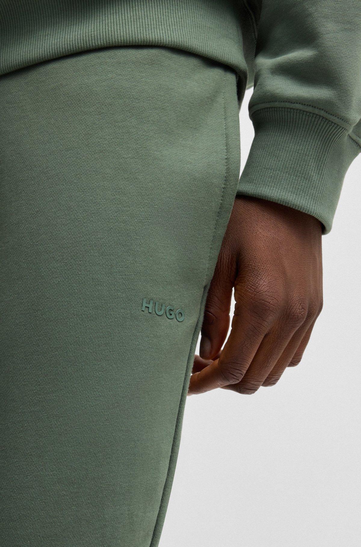 Cuffed tracksuit bottoms in cotton terry with logo print Product Image