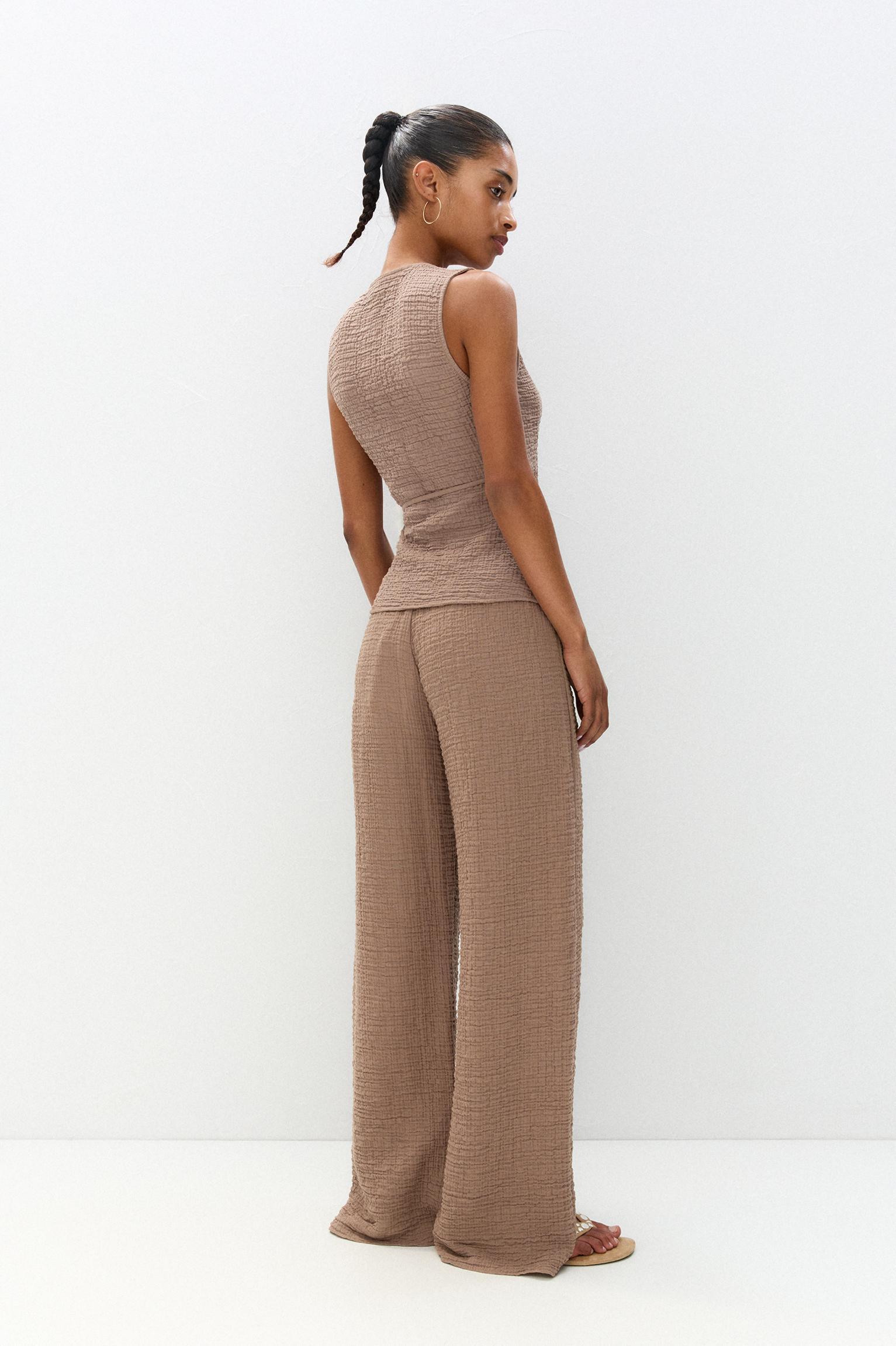 Rustic creased-effect pants Product Image