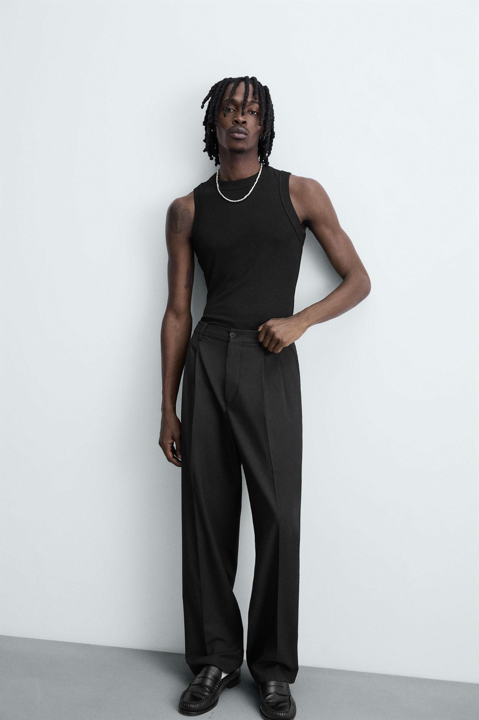 FLOWY PLEATED WIDE FIT PANTS Product Image