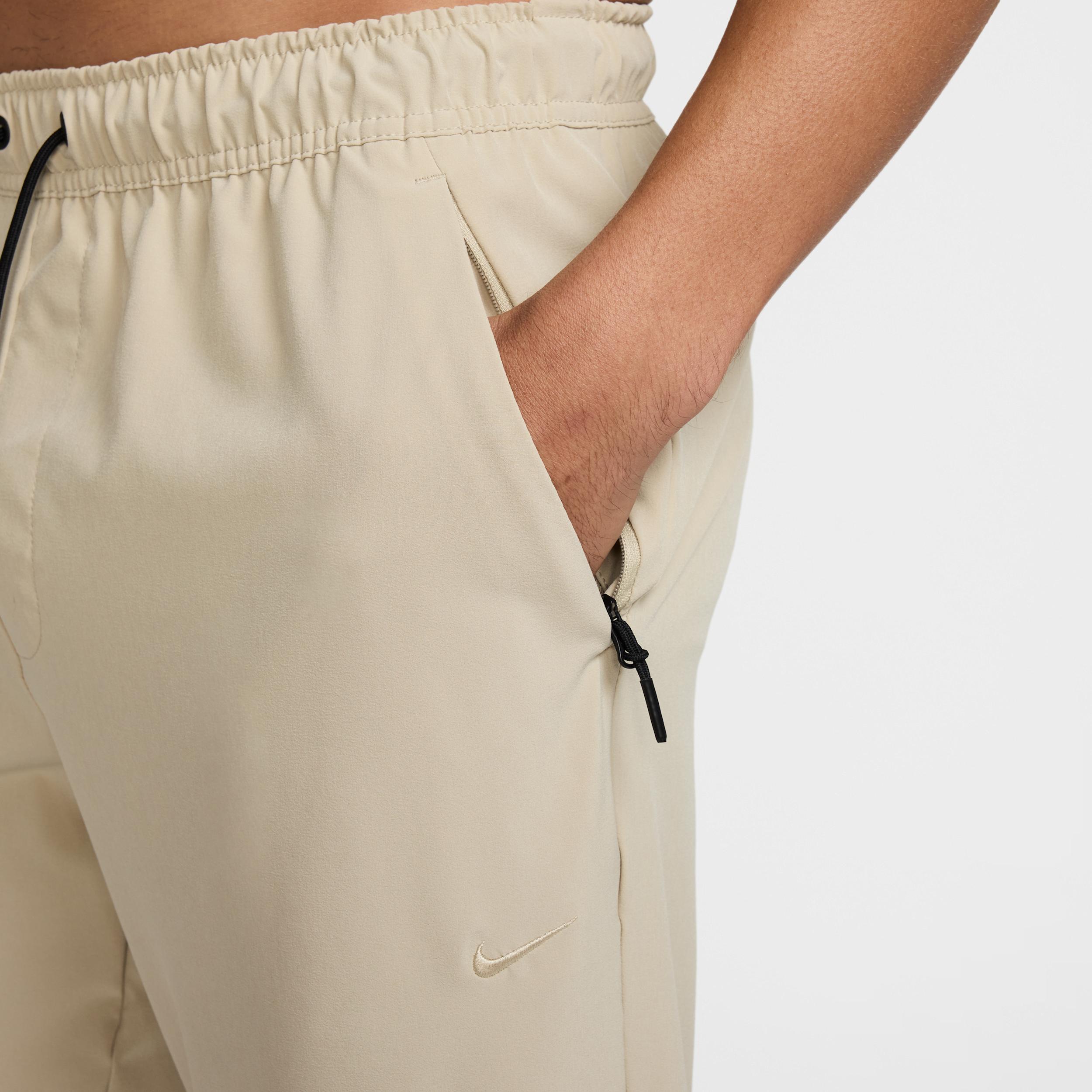 Nike Mens Unlimited Dri-FIT Tapered Leg Versatile Pants | FB7546-251 Product Image