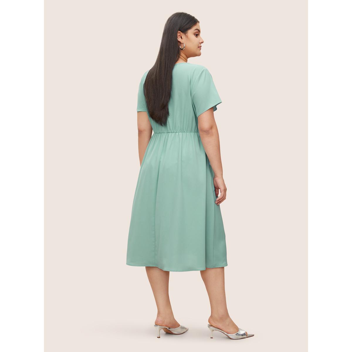 Plus Size Static-Free Overlap Collar Pleated Tie Knot Dress Mint Women At the Office Overlapping Overlap Collar Short sleeve Curvy Midi Dress BloomChic 26/4X Product Image