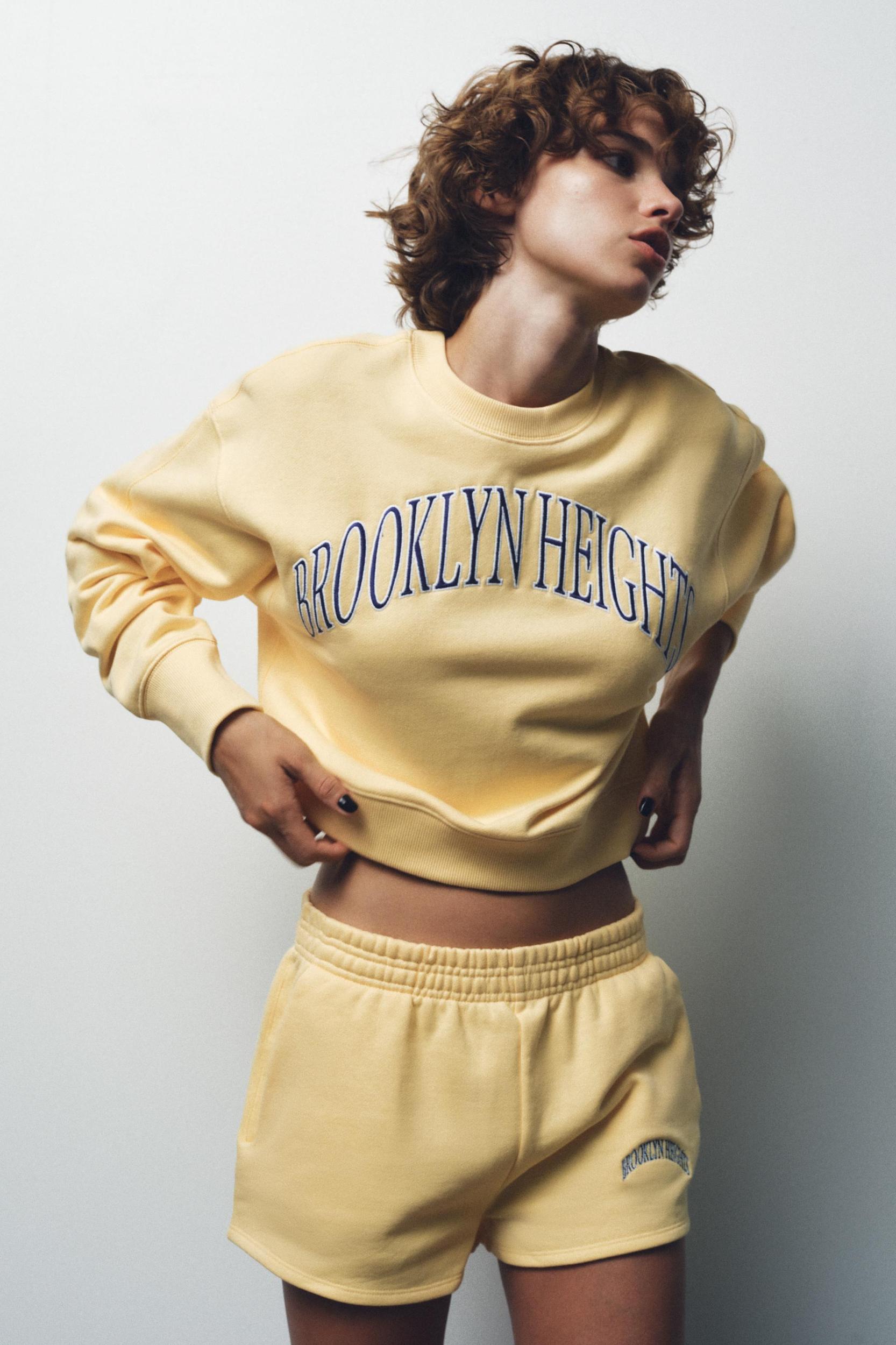 EMBROIDERED TEXT FLEECE SHORTS Product Image