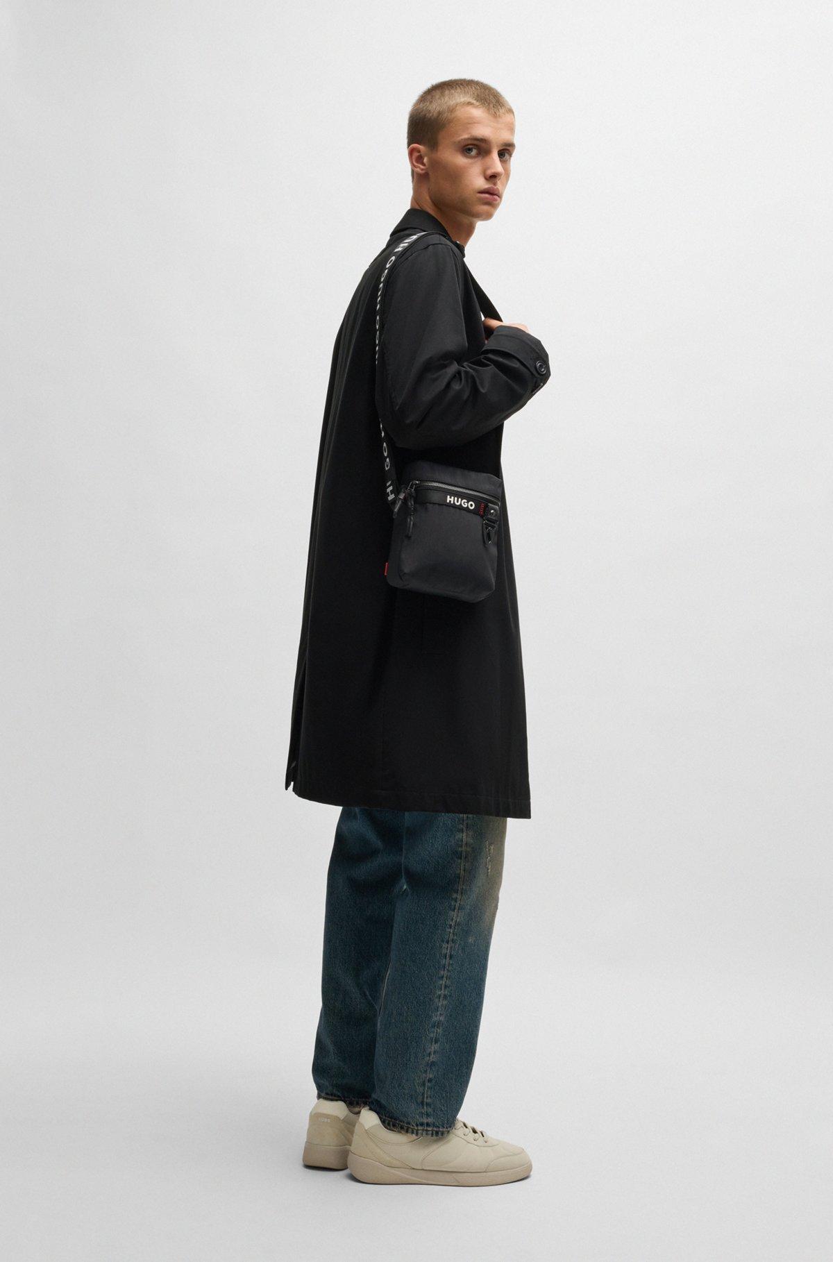 Reporter bag with branded adjustable strap and zip closure Product Image