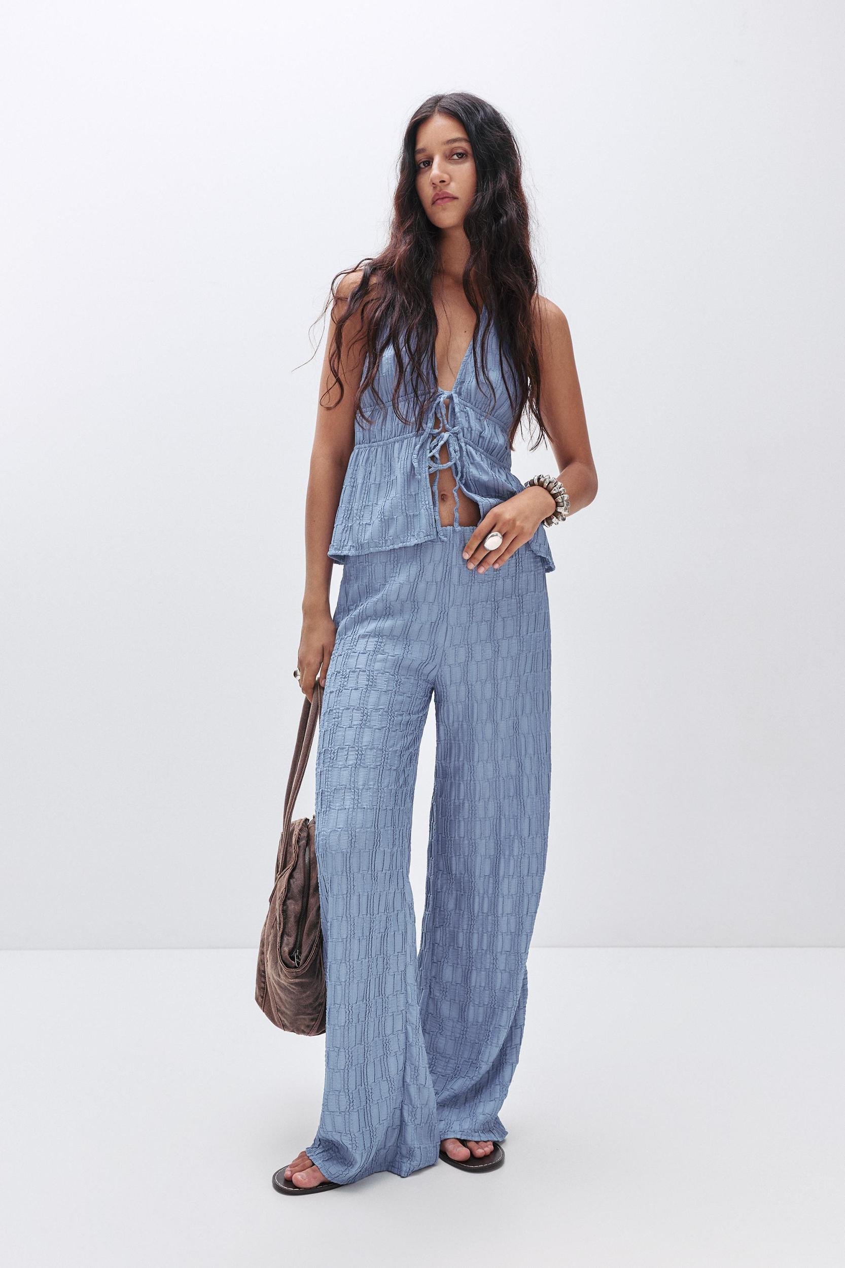 Textured bell bottom trousers Product Image