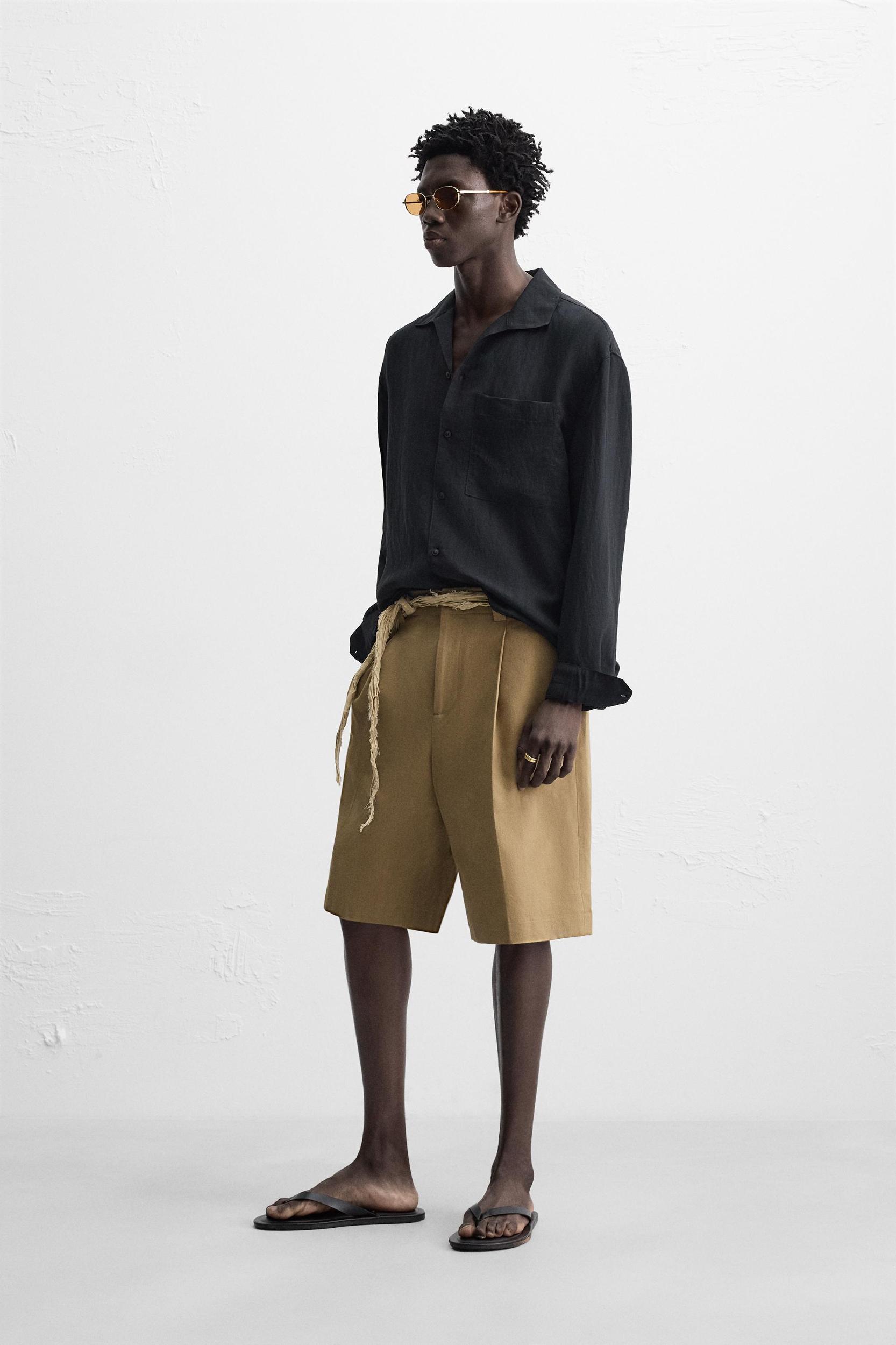RELAXED FIT PLEATED SHORTS Product Image