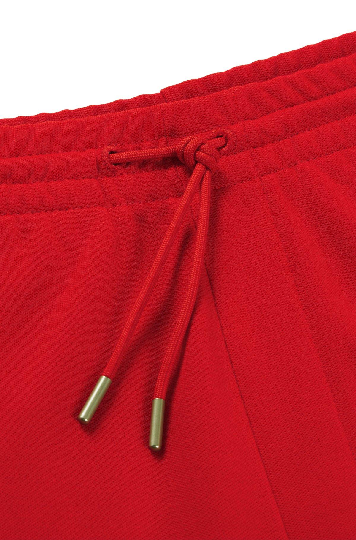 HUGO - Tracksuit bottoms with checked tape - light pink Product Image