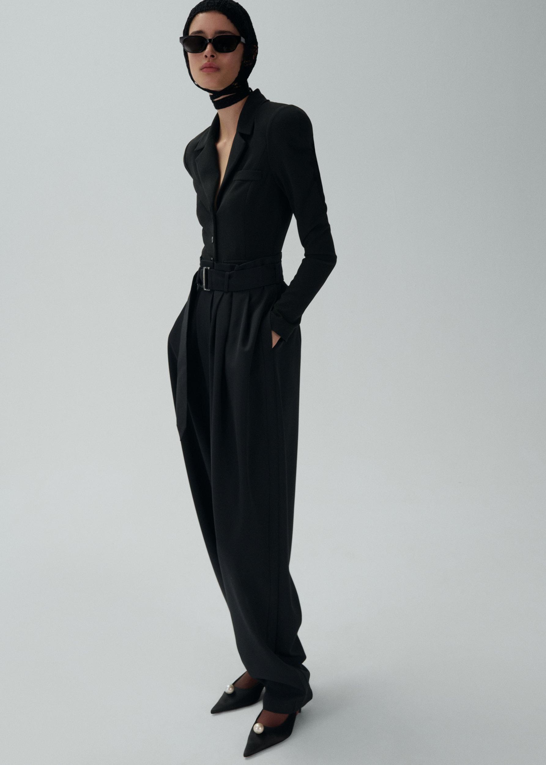 Wide belted tapered trousers in black Product Image