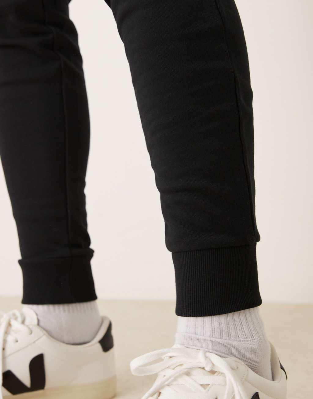 ASOS DESIGN essential skinny sweatpants in black Product Image