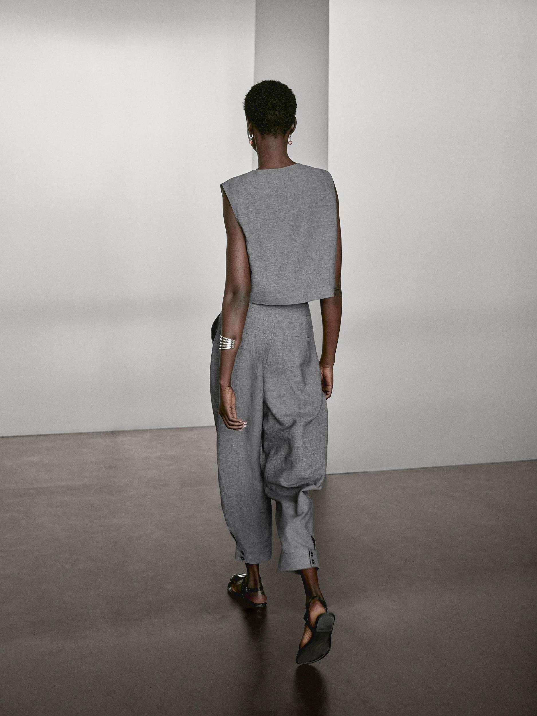 Balloon fit trousers with button details Product Image