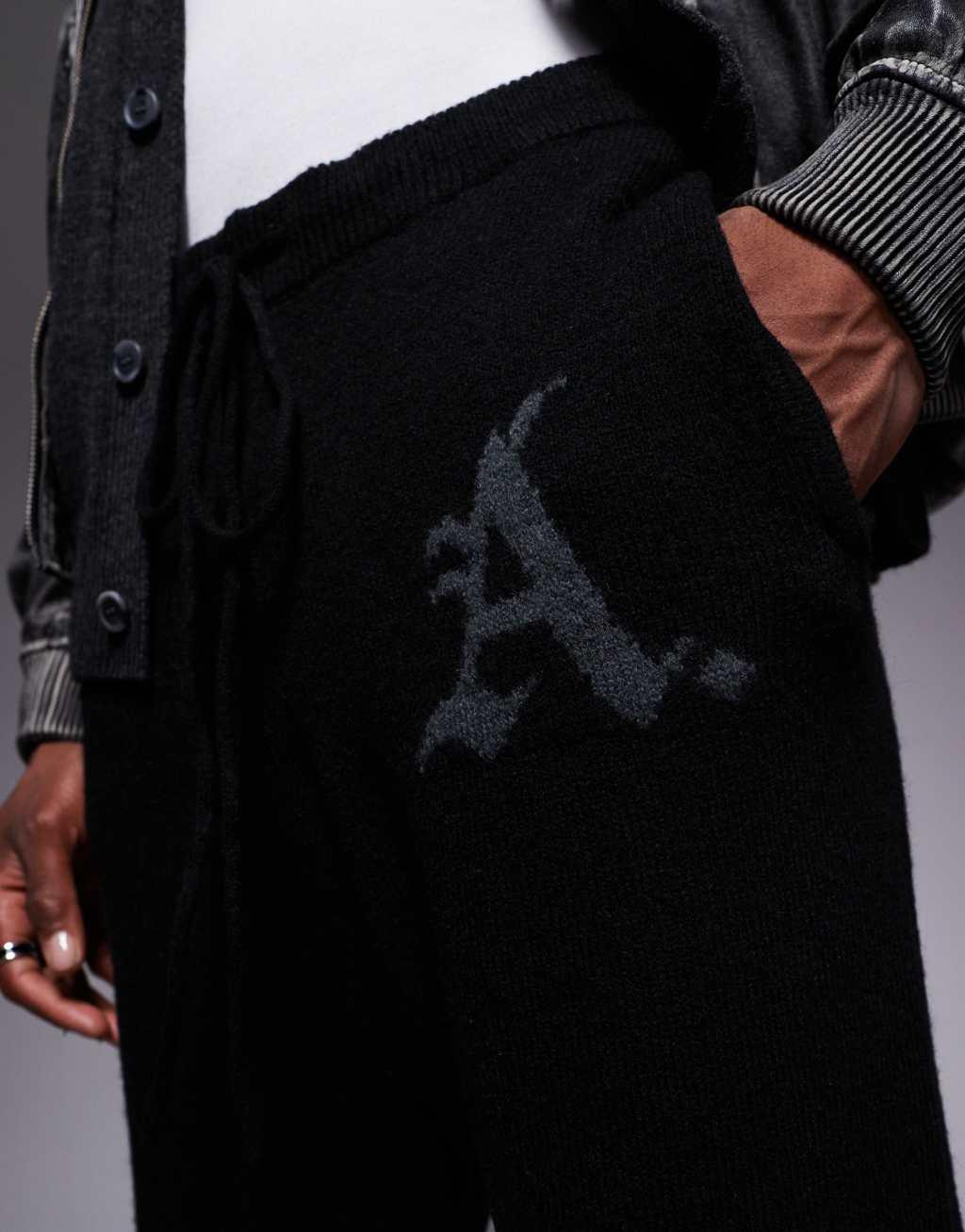 ADPT knitted loose fit sweatpants in black Product Image