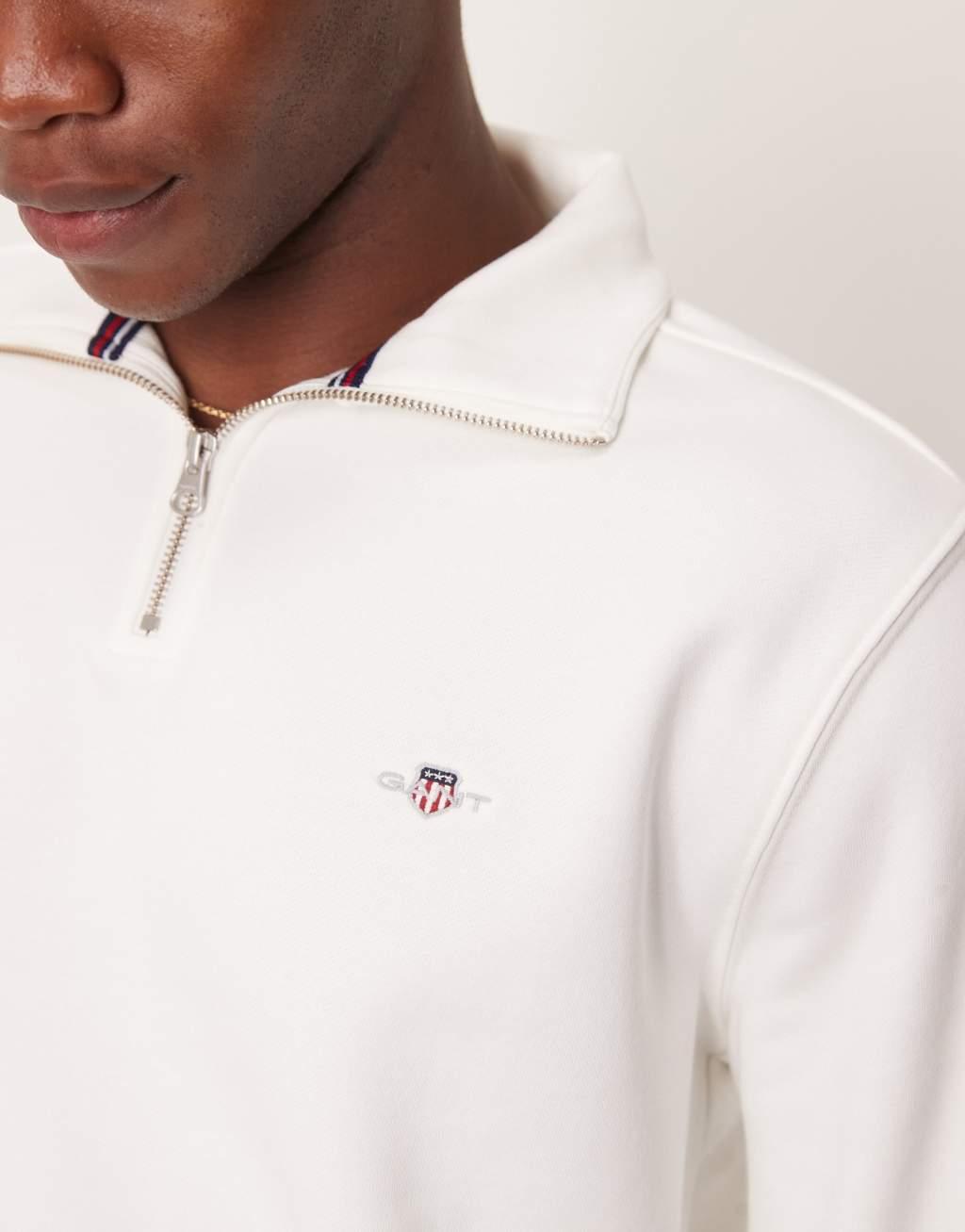 GANT shield logo half zip sweatshirt in off-white Product Image