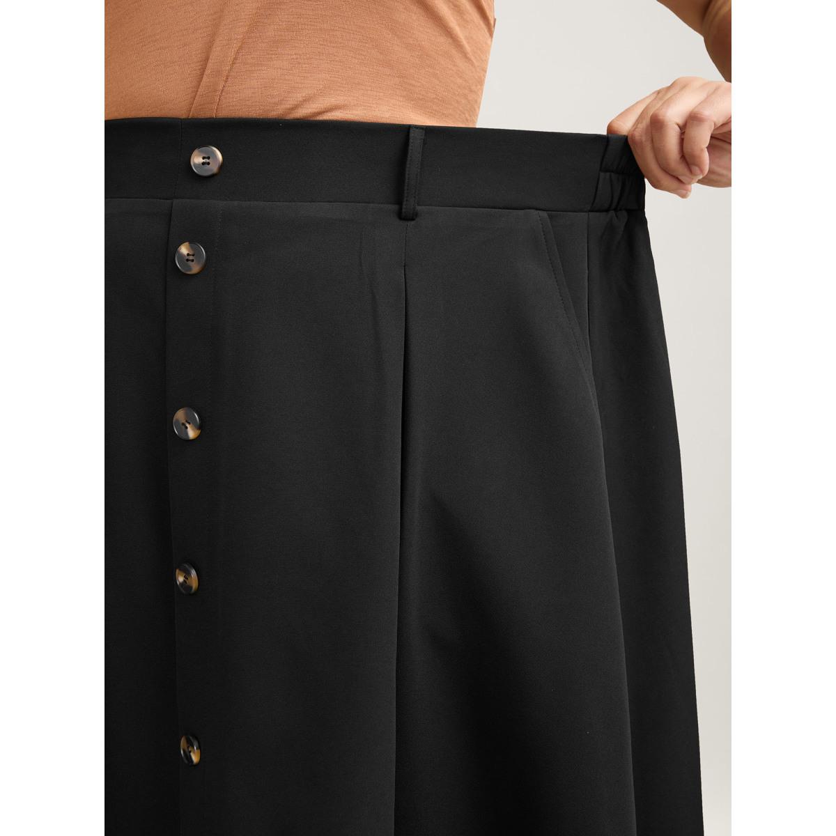 Plus Size Buckled Button Front Pleated Midi Skirt Women Black At the Office Pleated Low stretch Slanted pocket Work Skirts BloomChic 14-16/1X Product Image