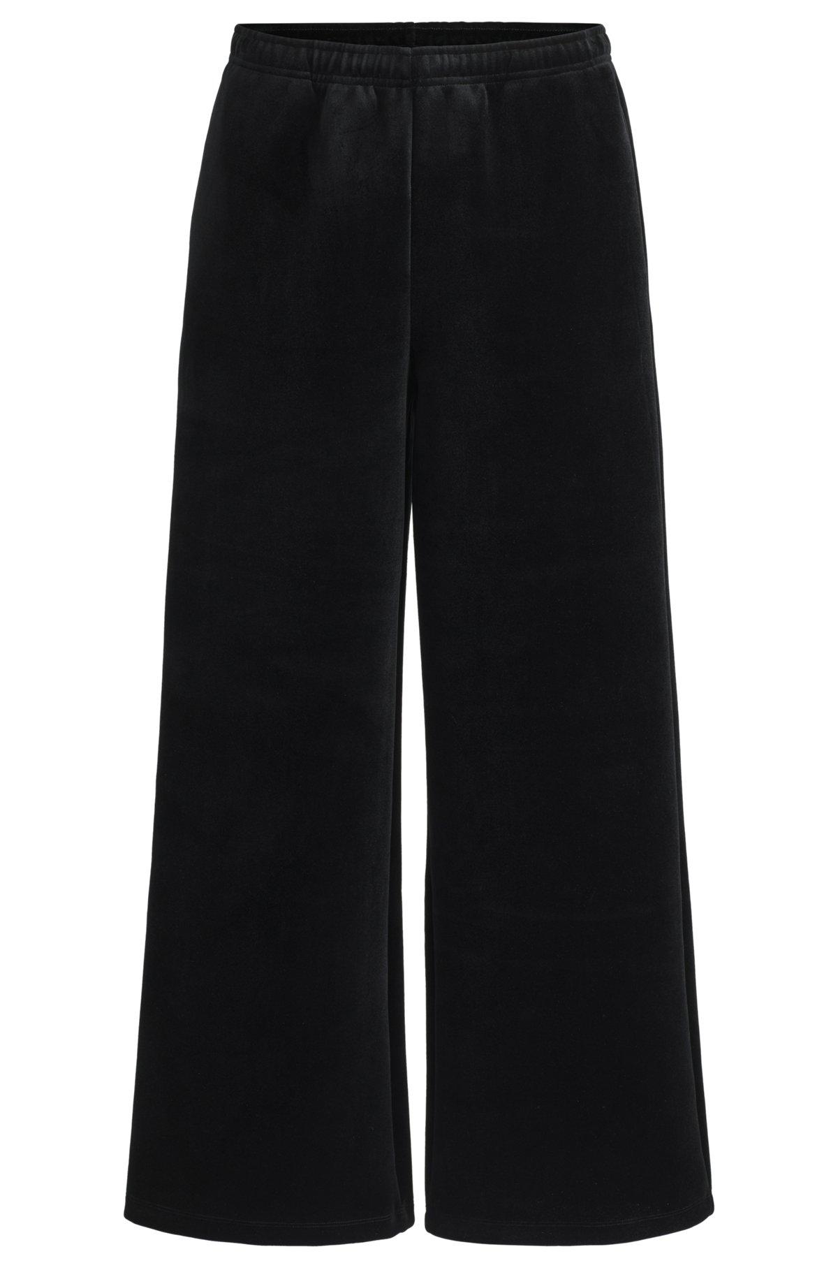Relaxed-fit tracksuit bottoms in stretch velour Product Image