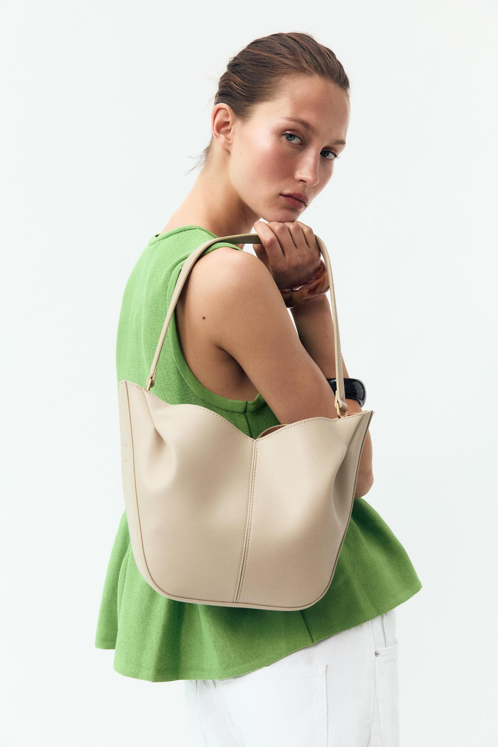 KNIT PEPLUM TOP Product Image