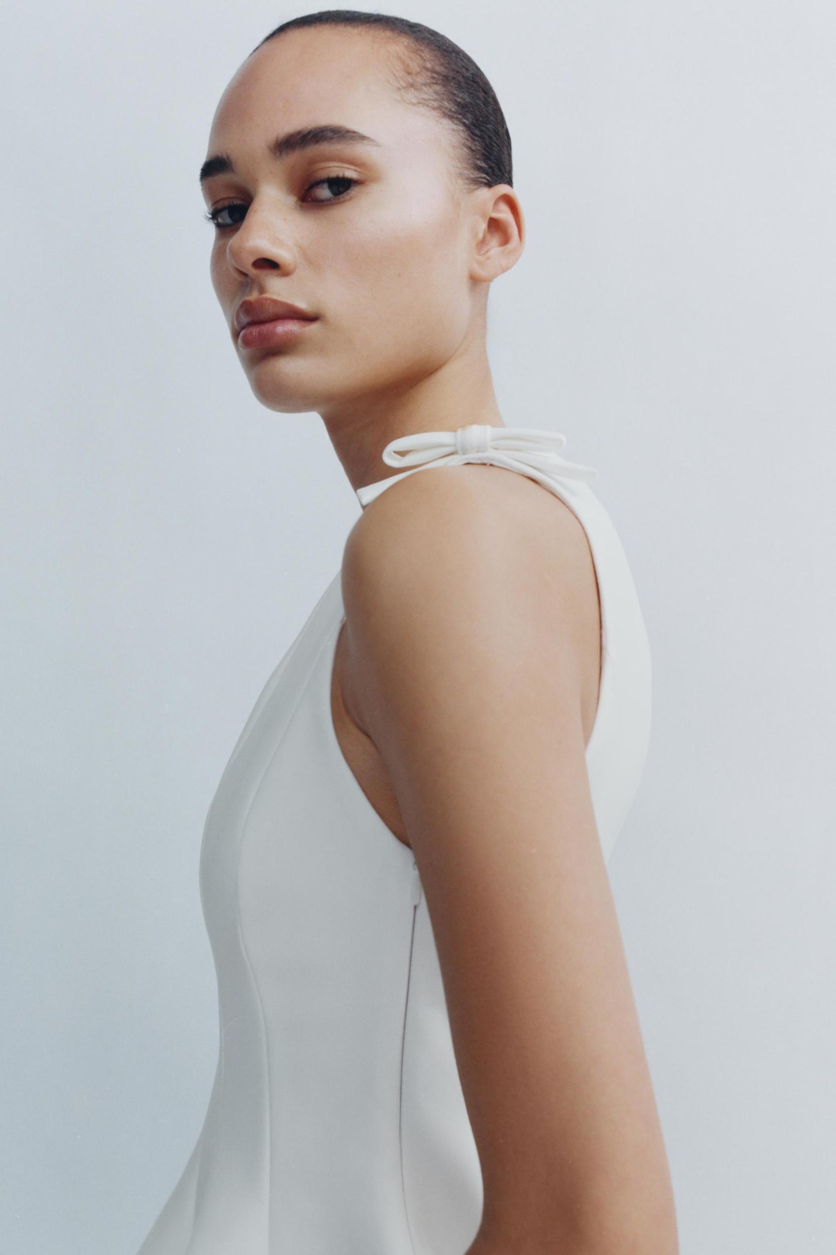 PEPLUM BOWS TOP Product Image