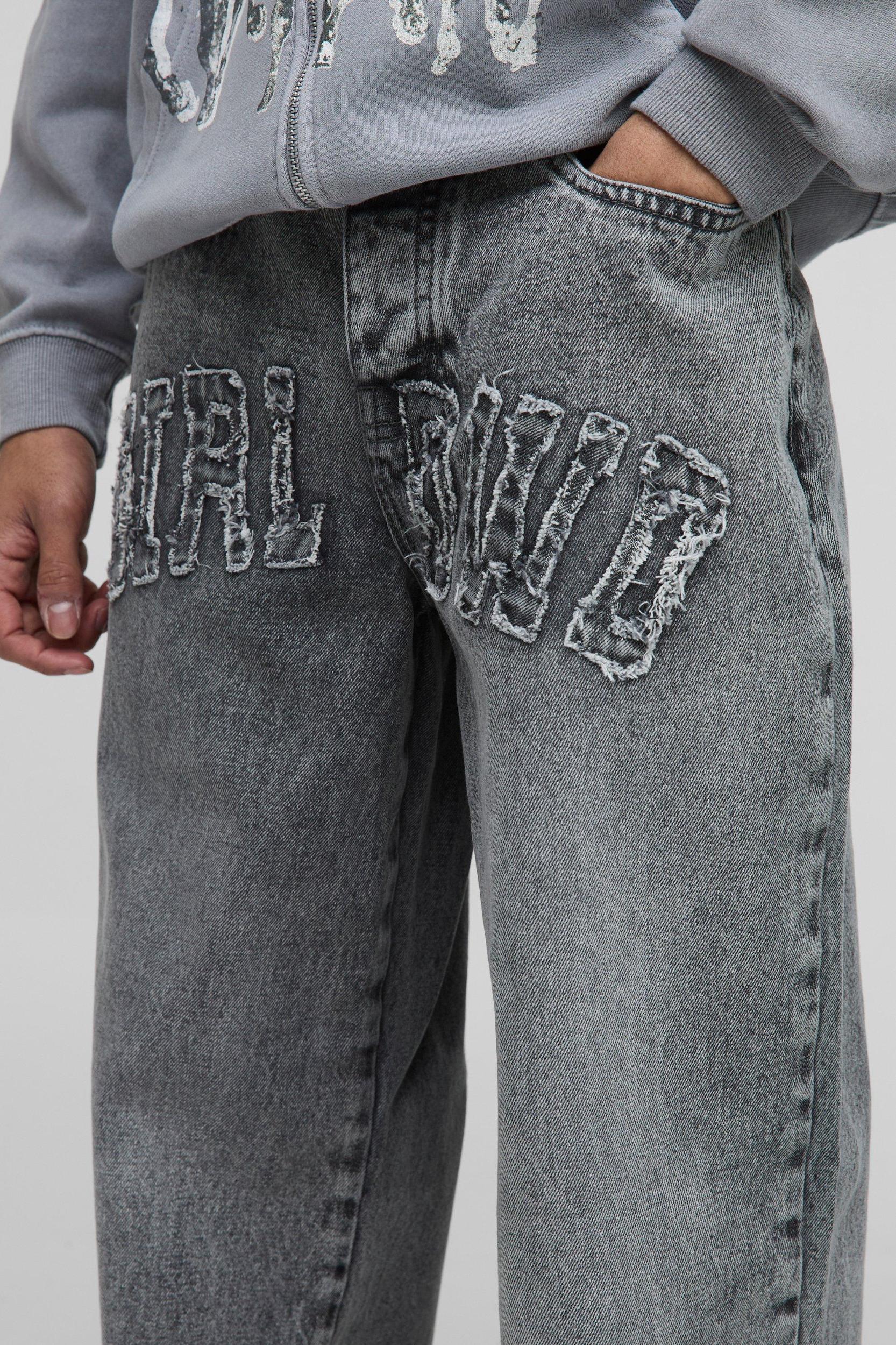 Relaxed Fit WRLDWD Applique Washed Jeans | boohooMAN USA Product Image