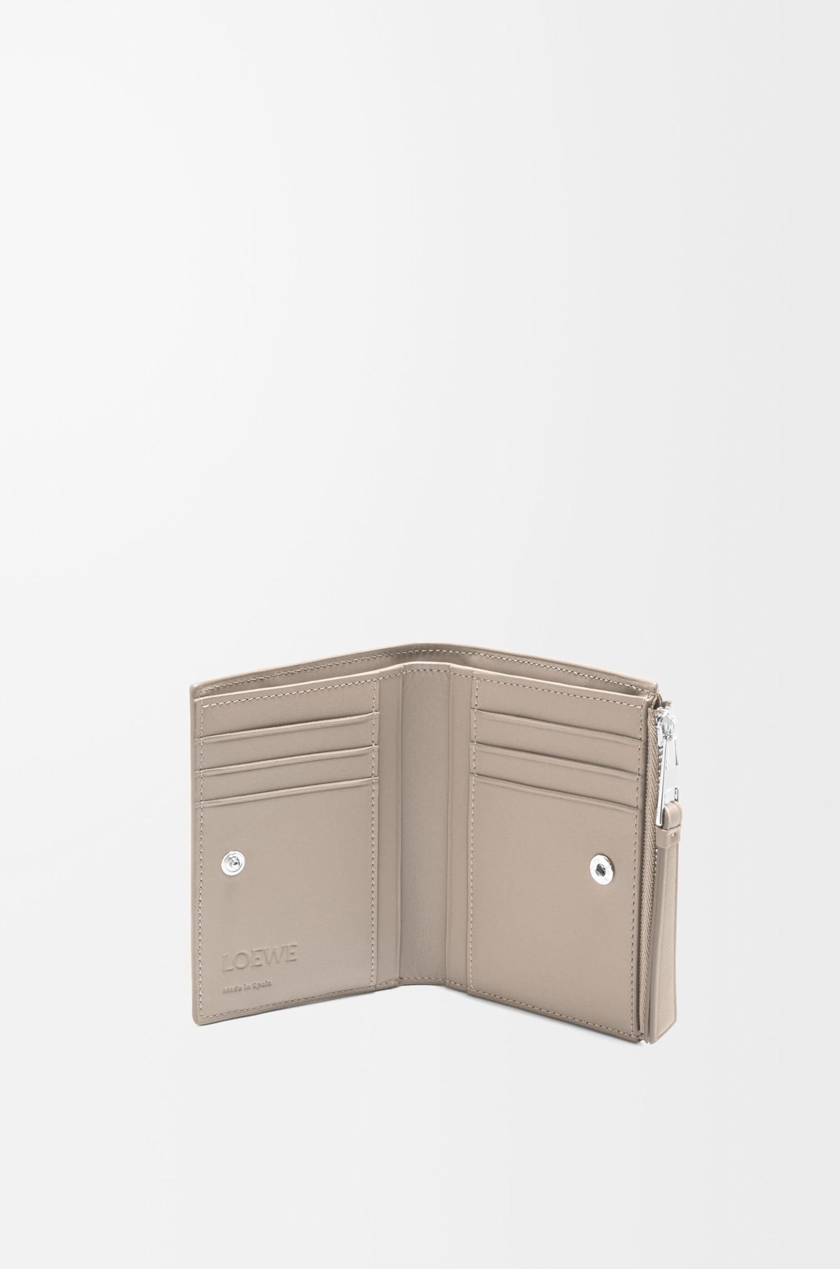 Puzzle slim compact wallet in classic calfskin Product Image