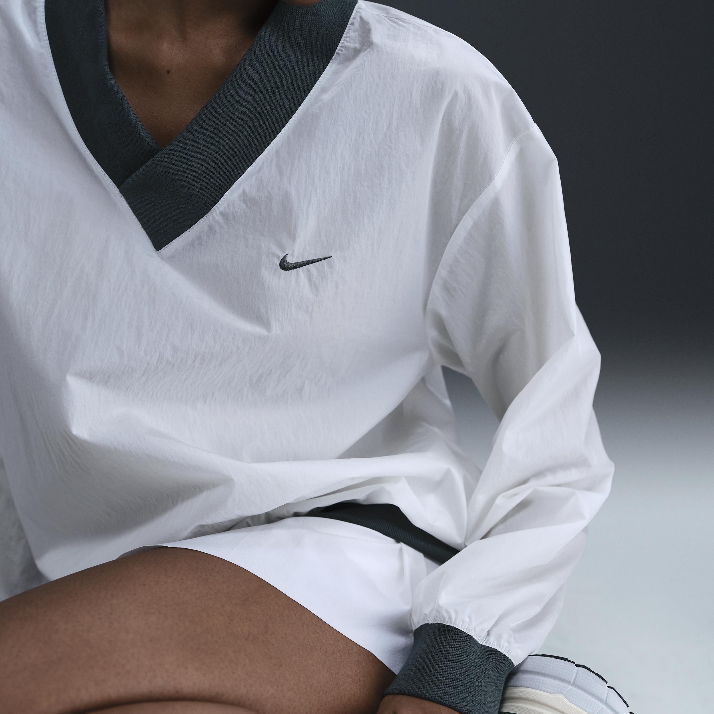 Women's Nike Sportswear Essential Loose UV Woven Long-Sleeve V-Neck Top Product Image