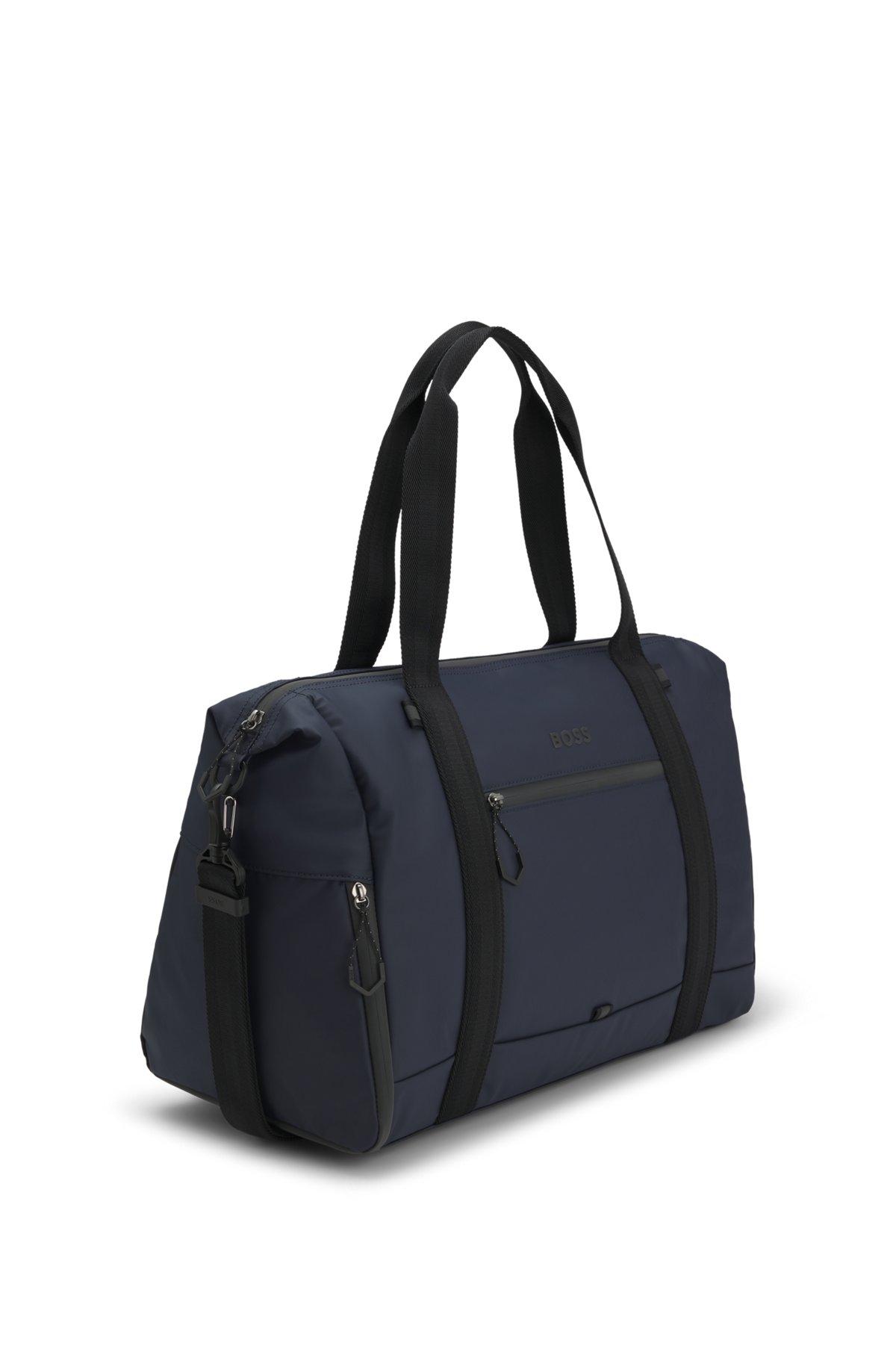 Reflective-detail holdall in faux leather Product Image