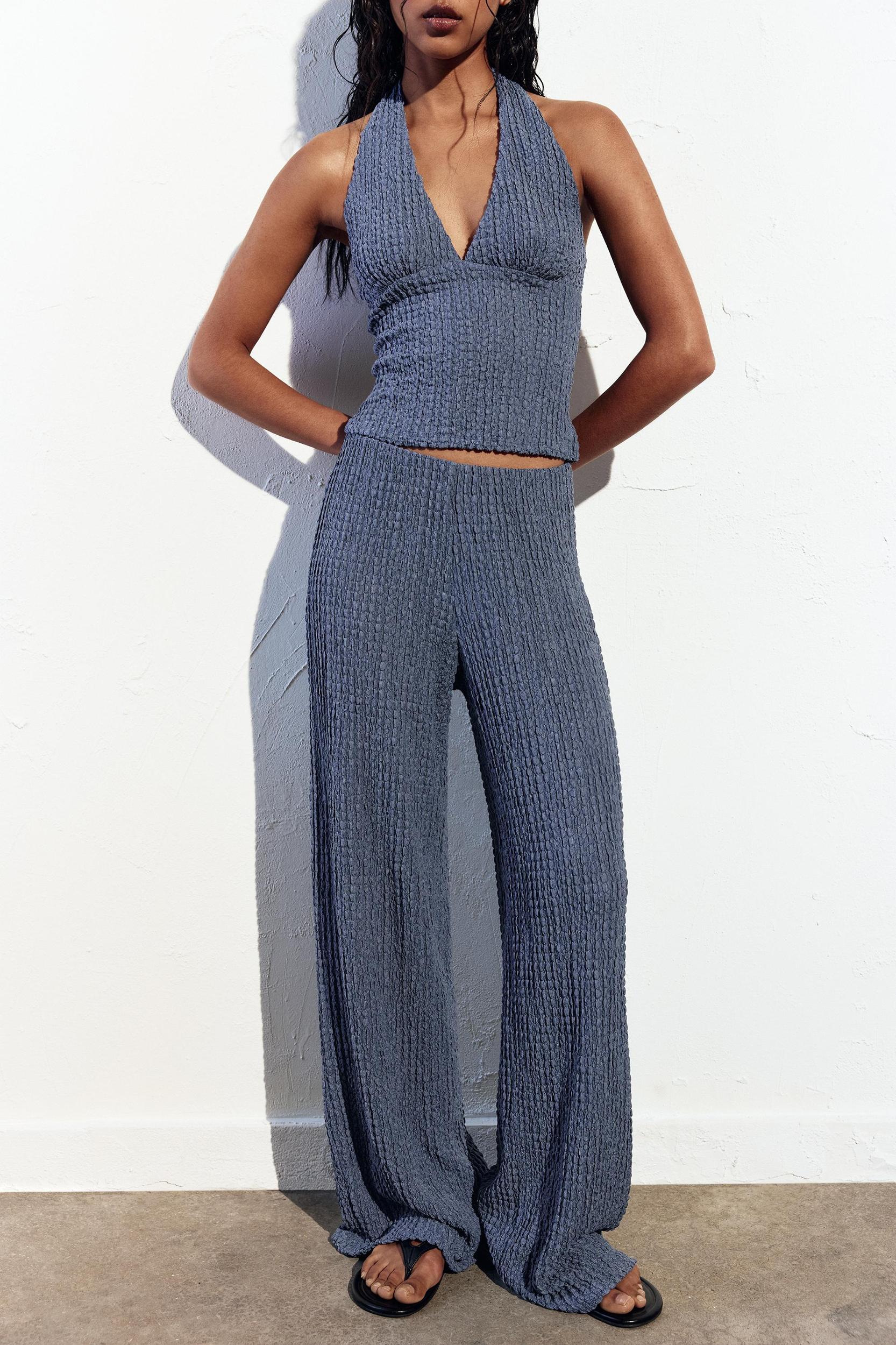 Rustic creased-effect pants Product Image