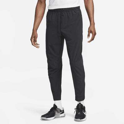 Nike Mens Unlimited Dri-FIT Zippered Cuff Versatile Pants | FB7548-320 Product Image