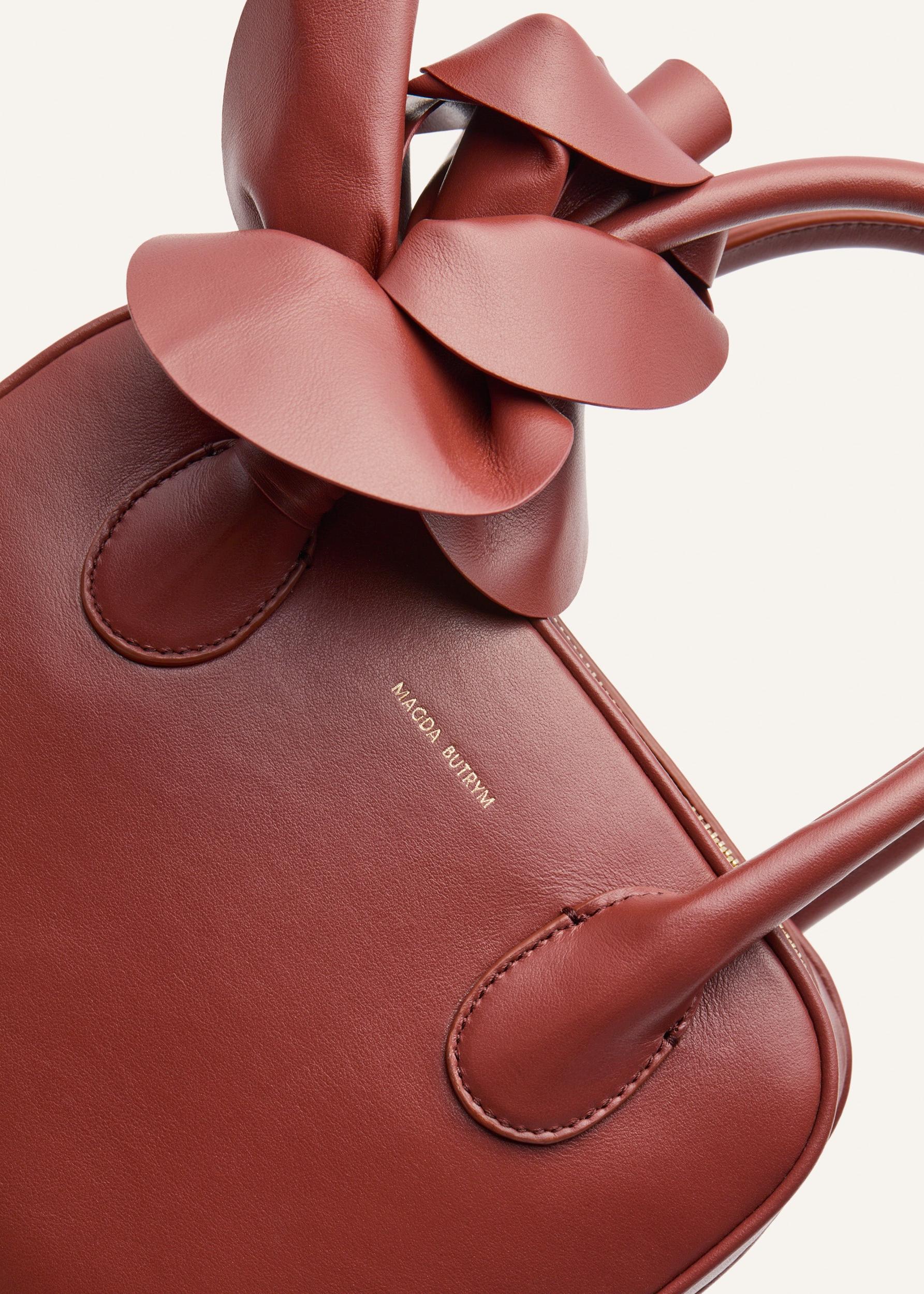 Brigitte square bag in amber leather and gold Product Image