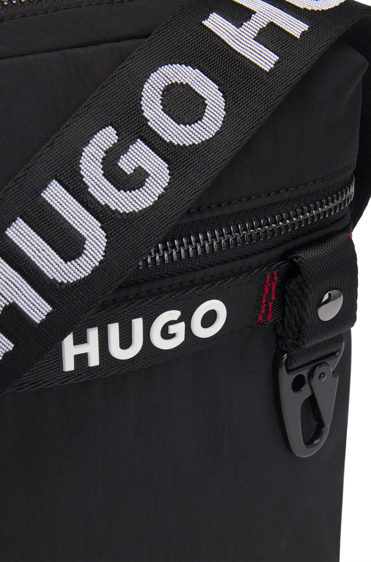 Reporter bag with branded adjustable strap and zip closure Product Image