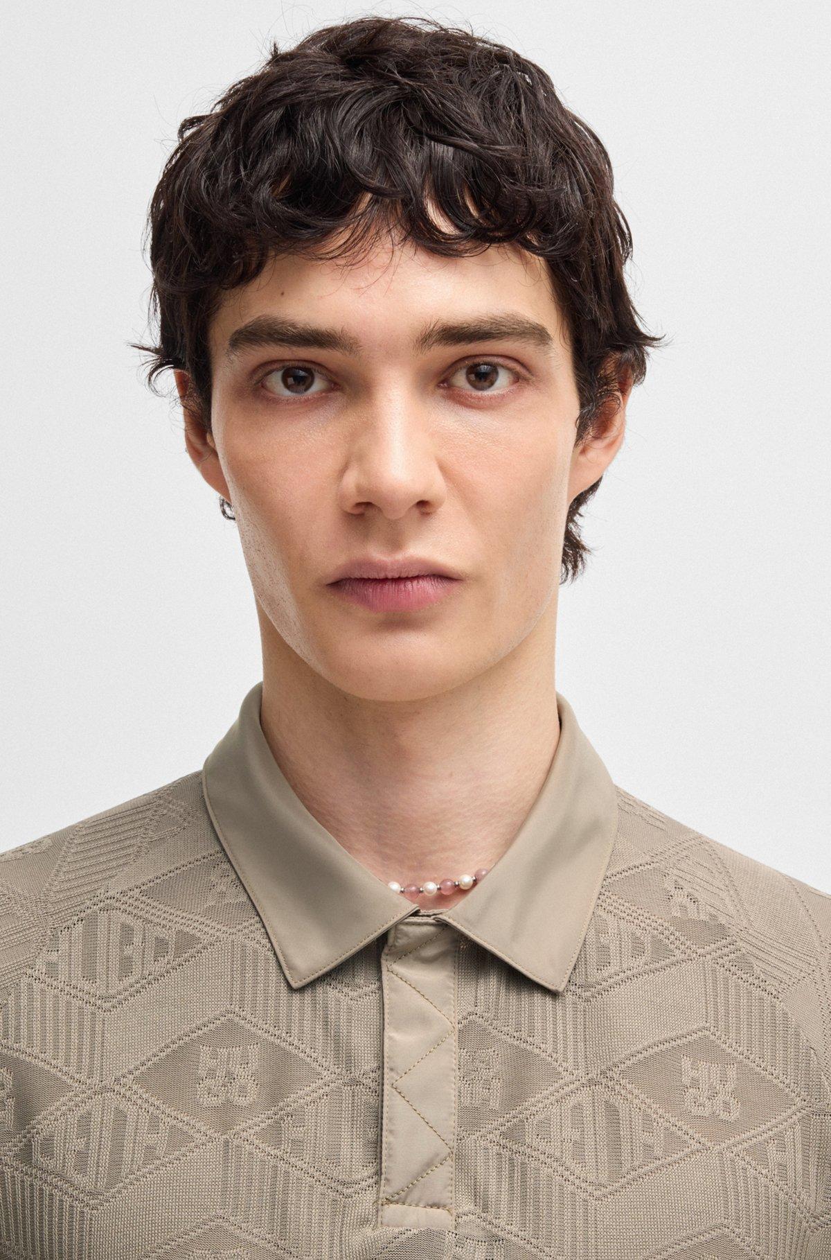 Logo-pattern polo shirt with contrast placket Product Image