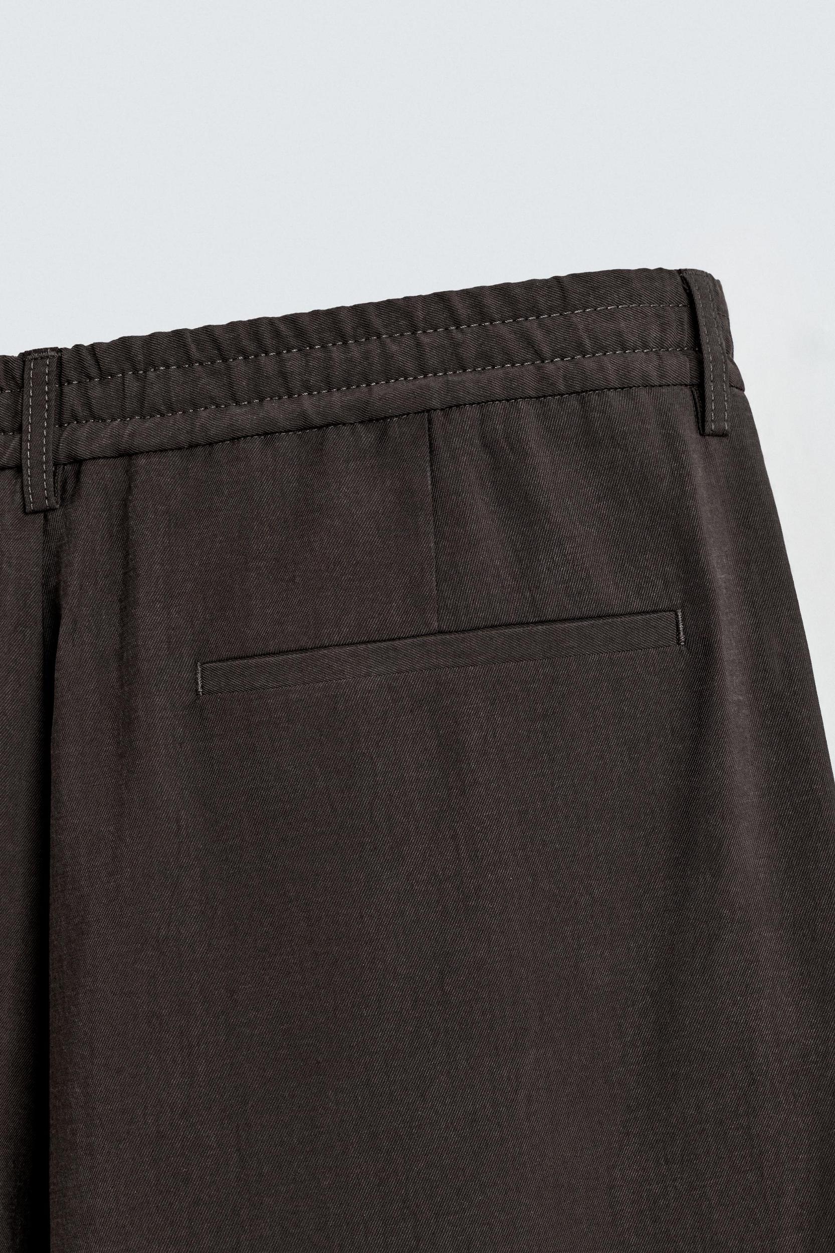 PLEATED FLOWY PANTS Product Image