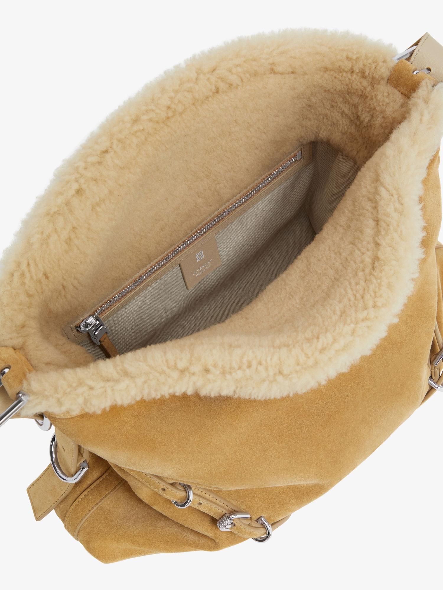 Medium Voyou bag in suede and shearling Product Image
